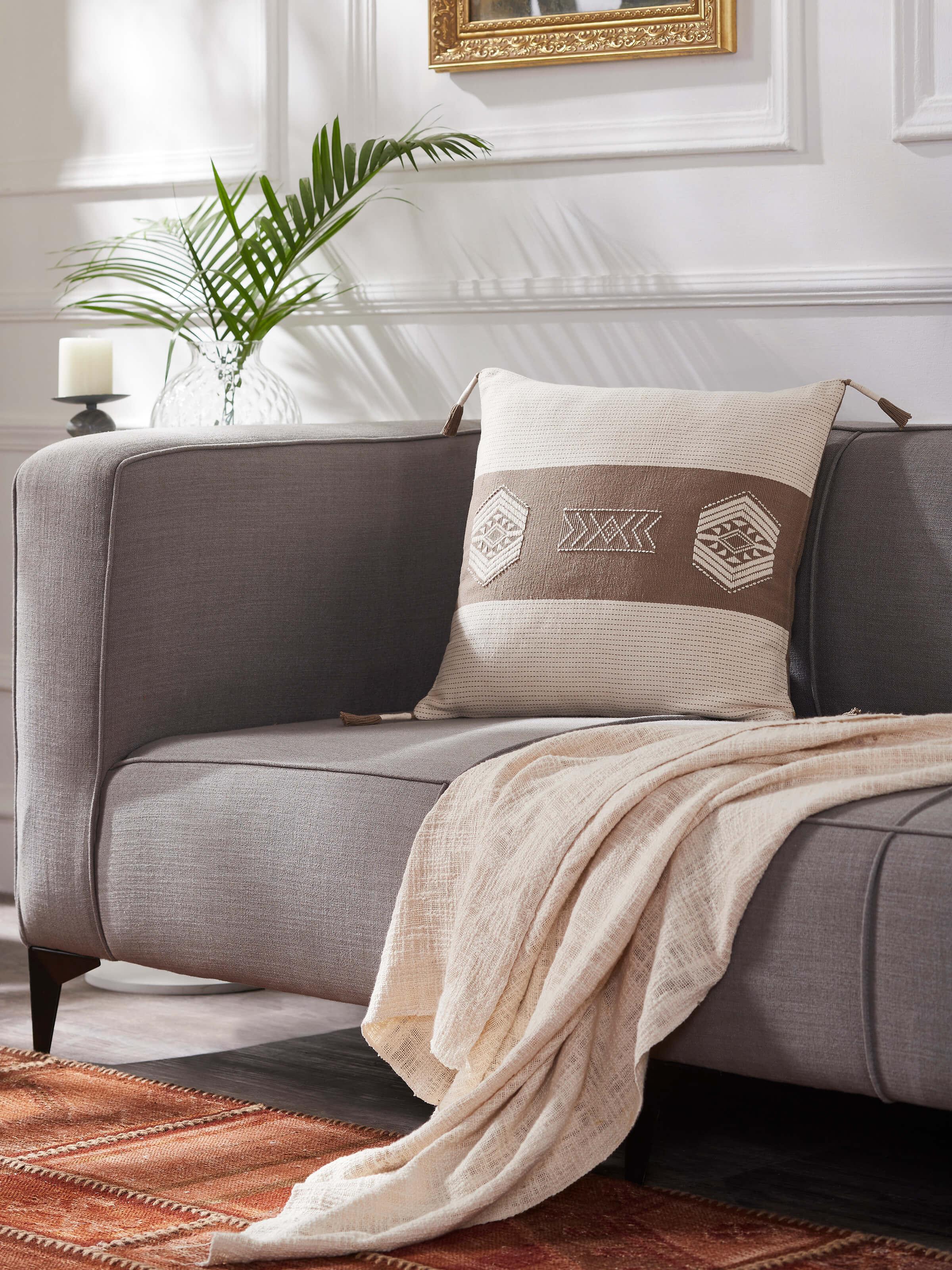 Close-up of Ridhama khakhi barnava cotton Naga handloom cushion cover highlighting the handloom fabric