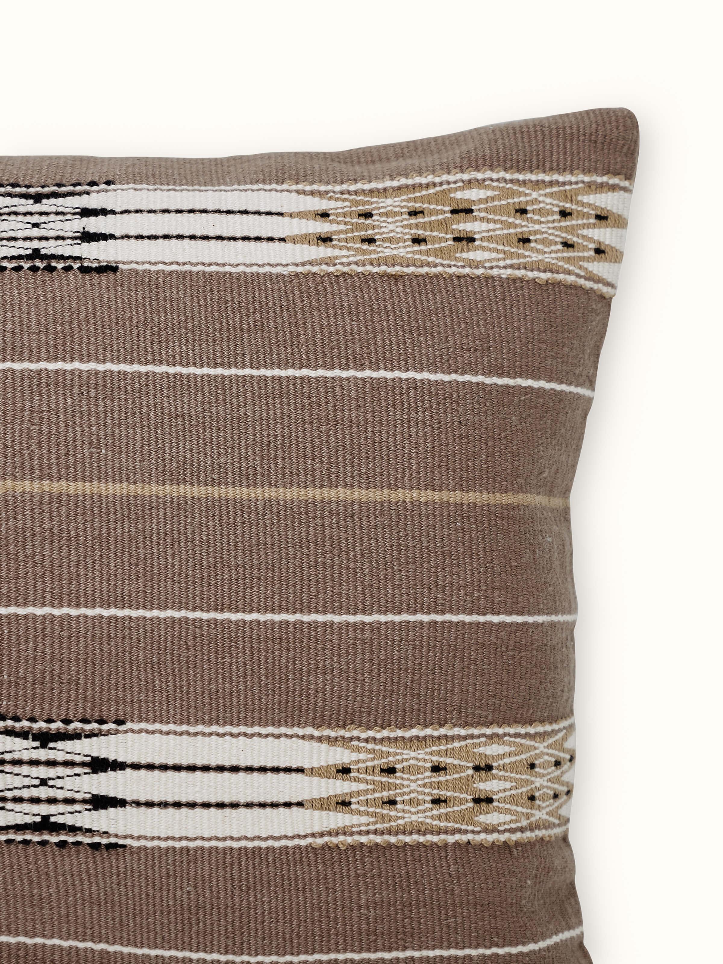 Detailed view of Ridhama khakhi jani cotton Naga handloom cushion cover showing the intricate handloom pattern and khakhi color.