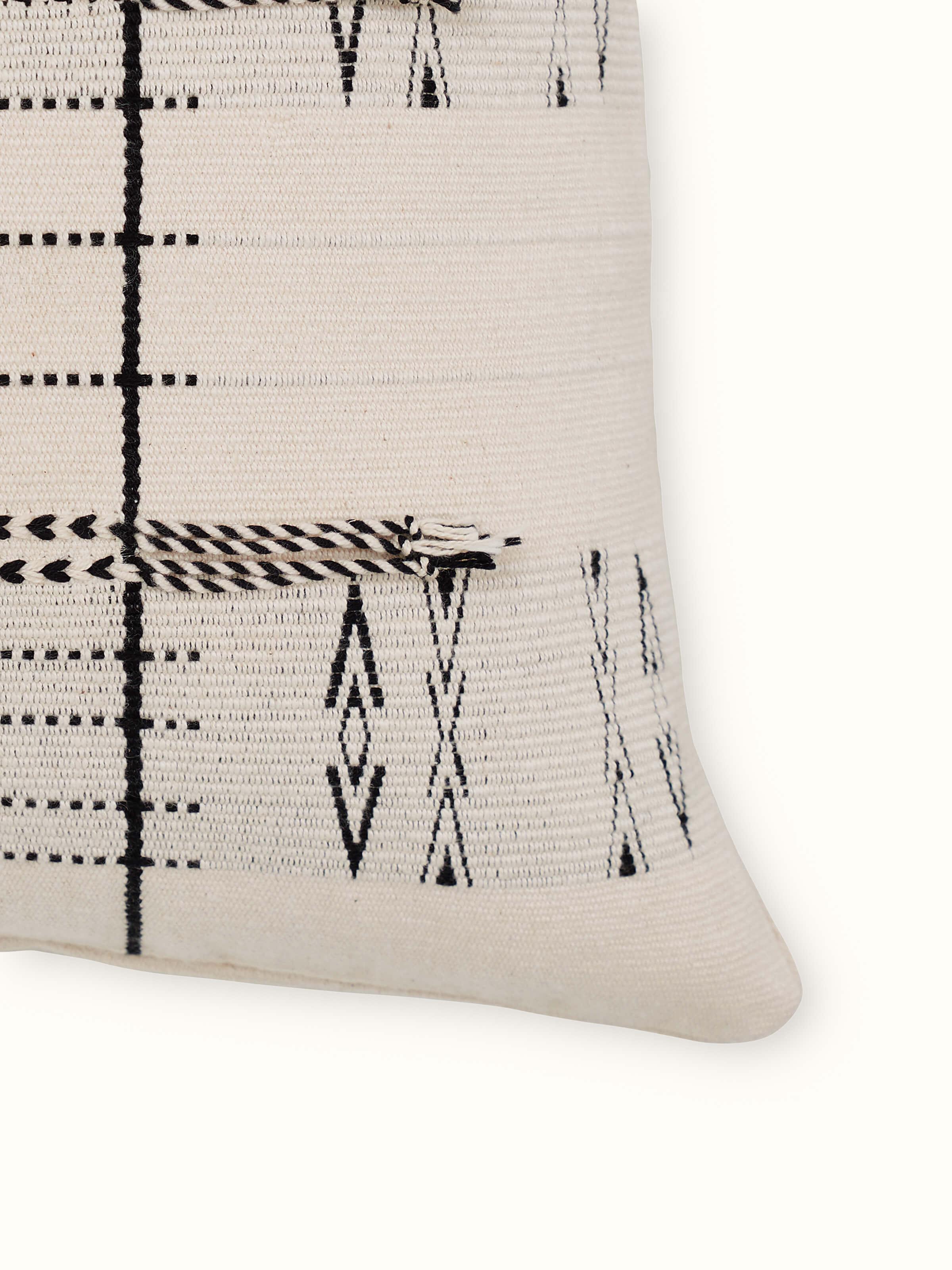 Detailed view of Ridhama White Lanka Cotton Naga Handloom Cushion Cover, focusing on the texture and pattern of the handloom fabric.