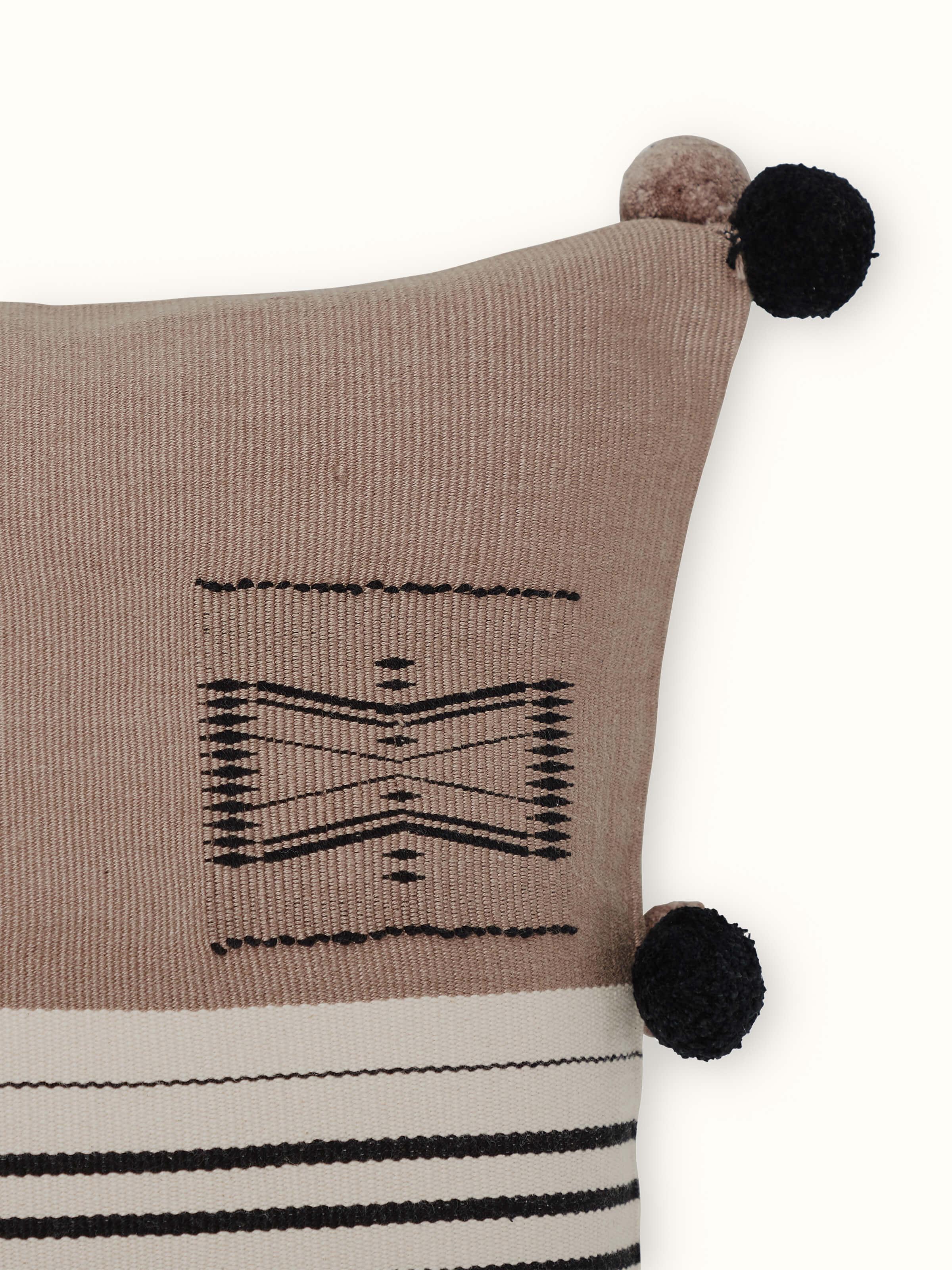 Angled shot showing detailed weave on khaki Naga cotton cushion cover.