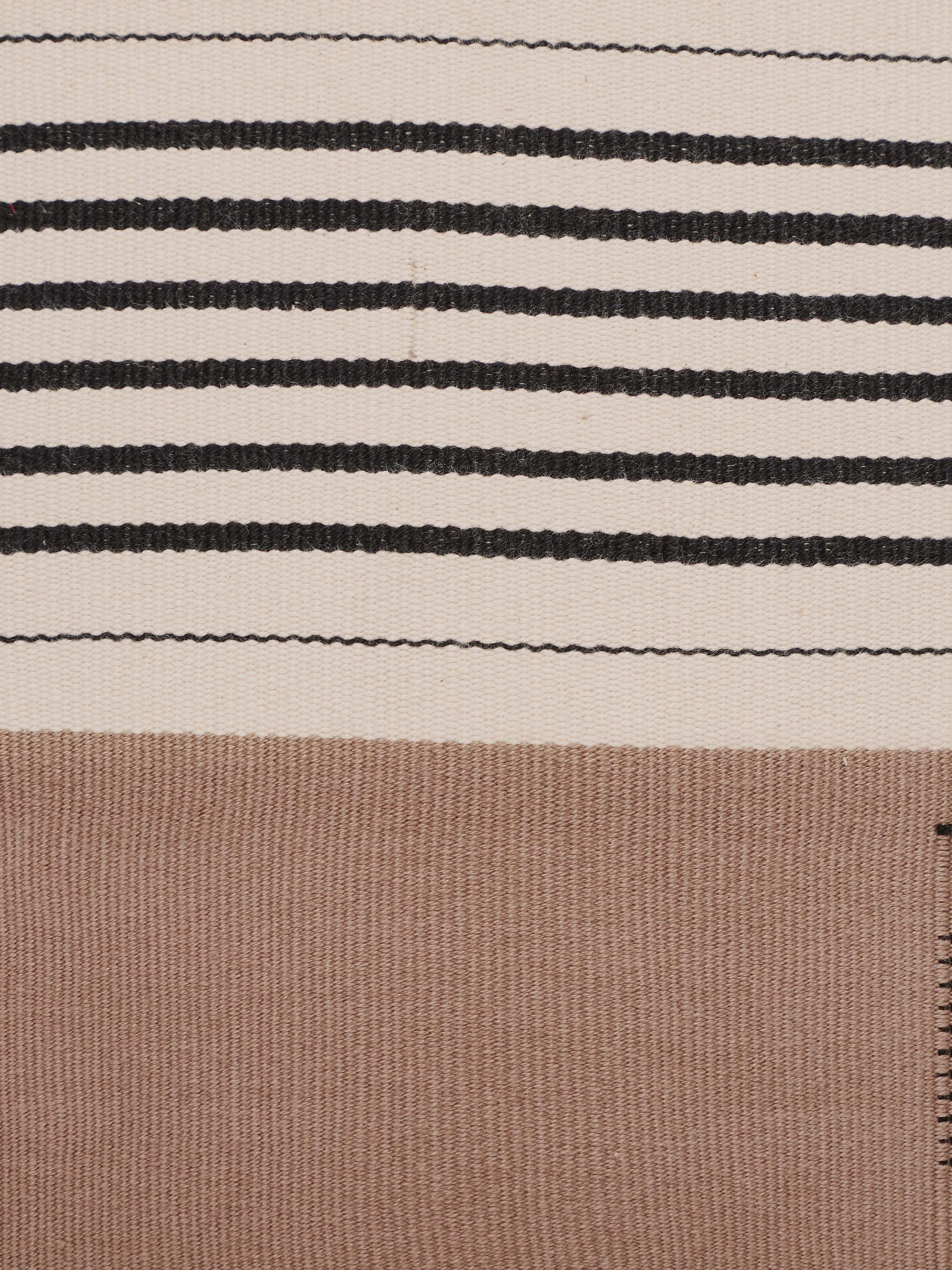 Close-up of handloom texture and weave of khaki cotton Naga cushion cover.