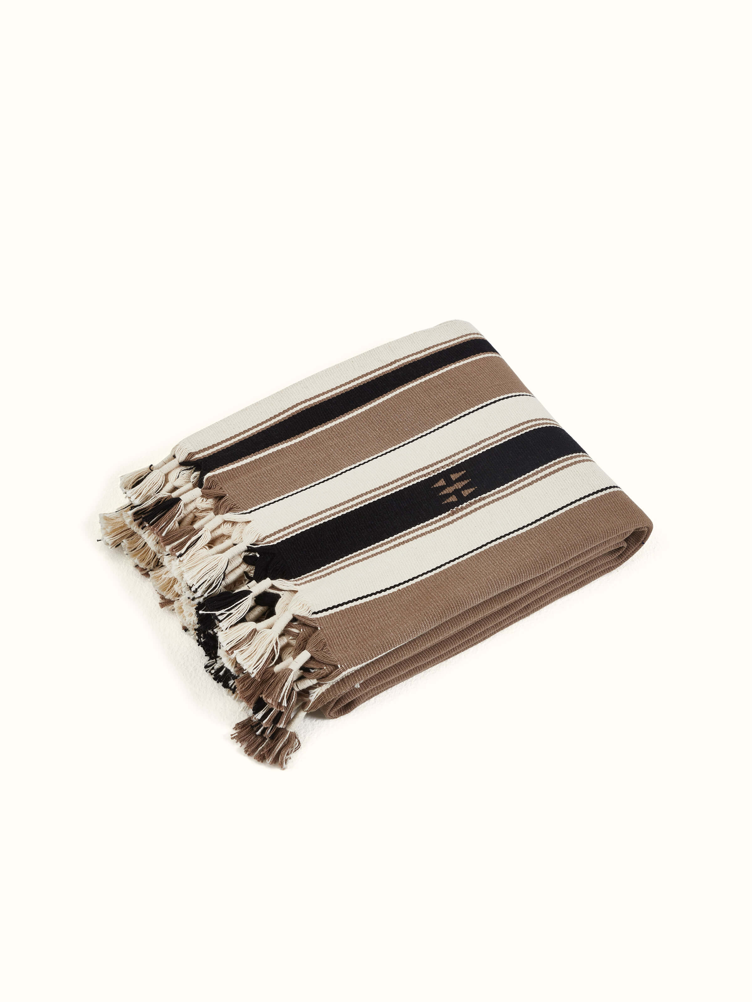 Angled view of Ridhama khakhi namrup cotton Naga handloom throw showcasing intricate patterns