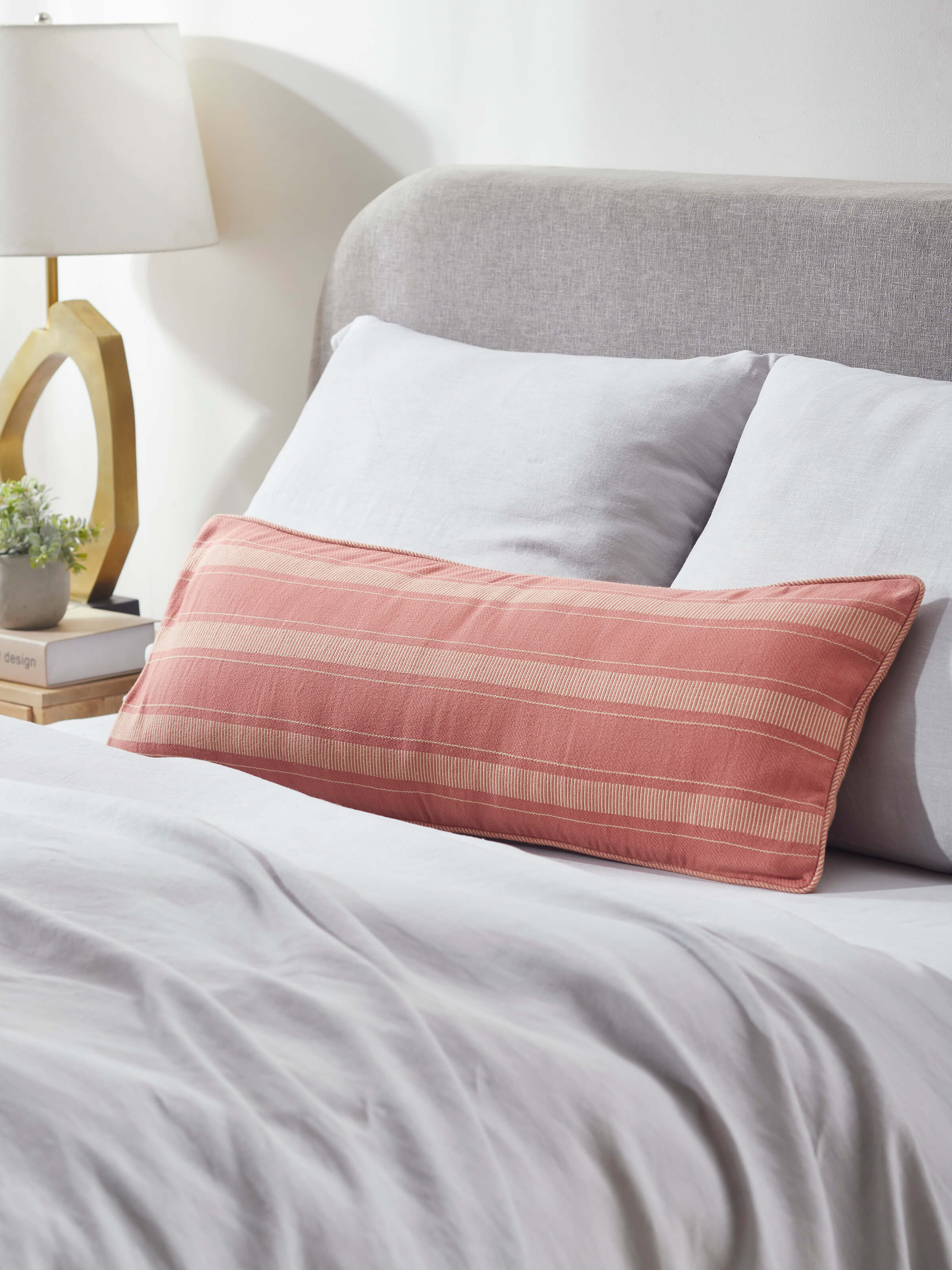 Detailed view of Godna peach stripe cotton handwoven pattu cushion cover highlighting the peach stripe pattern and fabric quality.