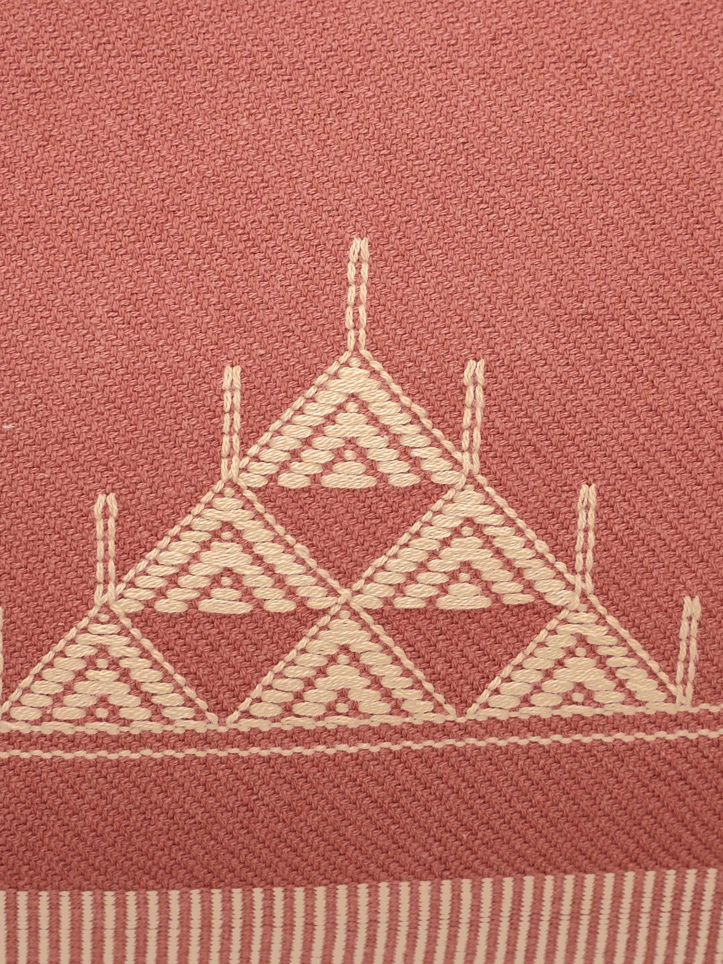 Detail shot of triangle Buta weave on peach handwoven cotton cushion cover