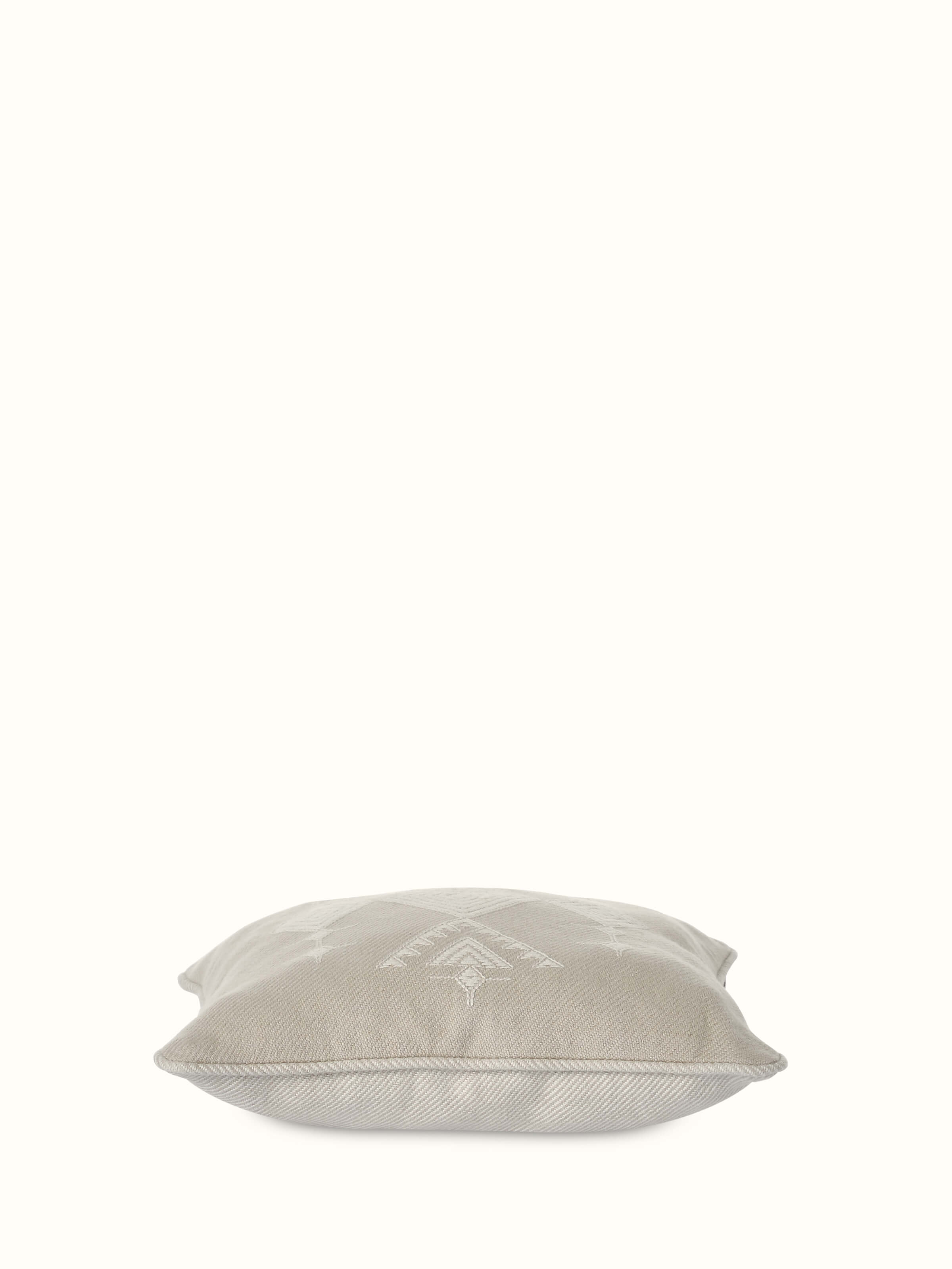 Godna light beige buta cotton handwoven pattu cushion cover with a focus on the intricate handwoven buta design and texture.