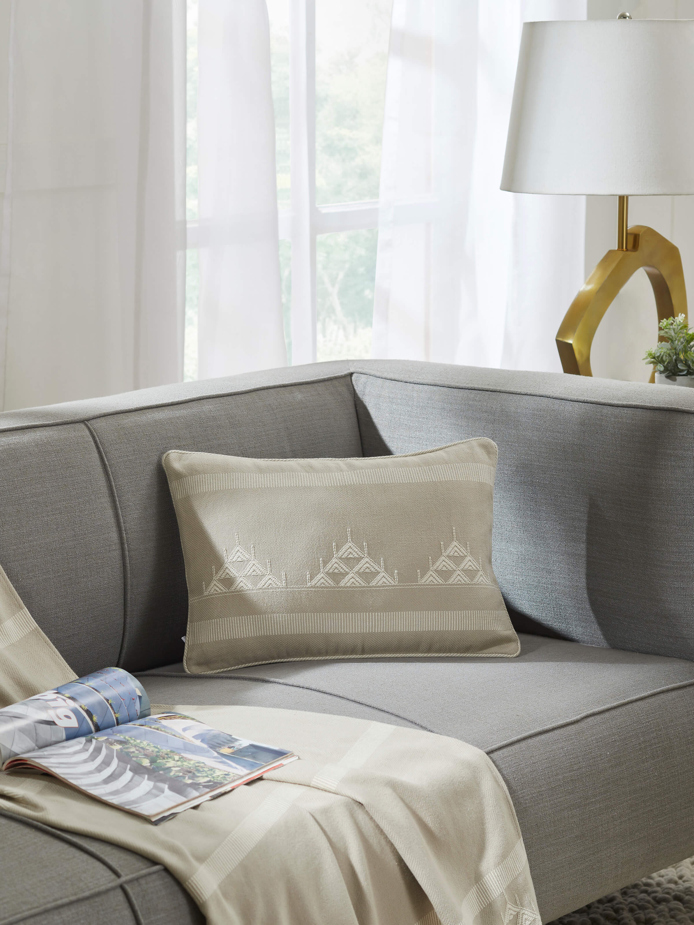 Close-up of Godna light beige triangular stripe cotton handwoven pattu cushion cover, highlighting the stripes