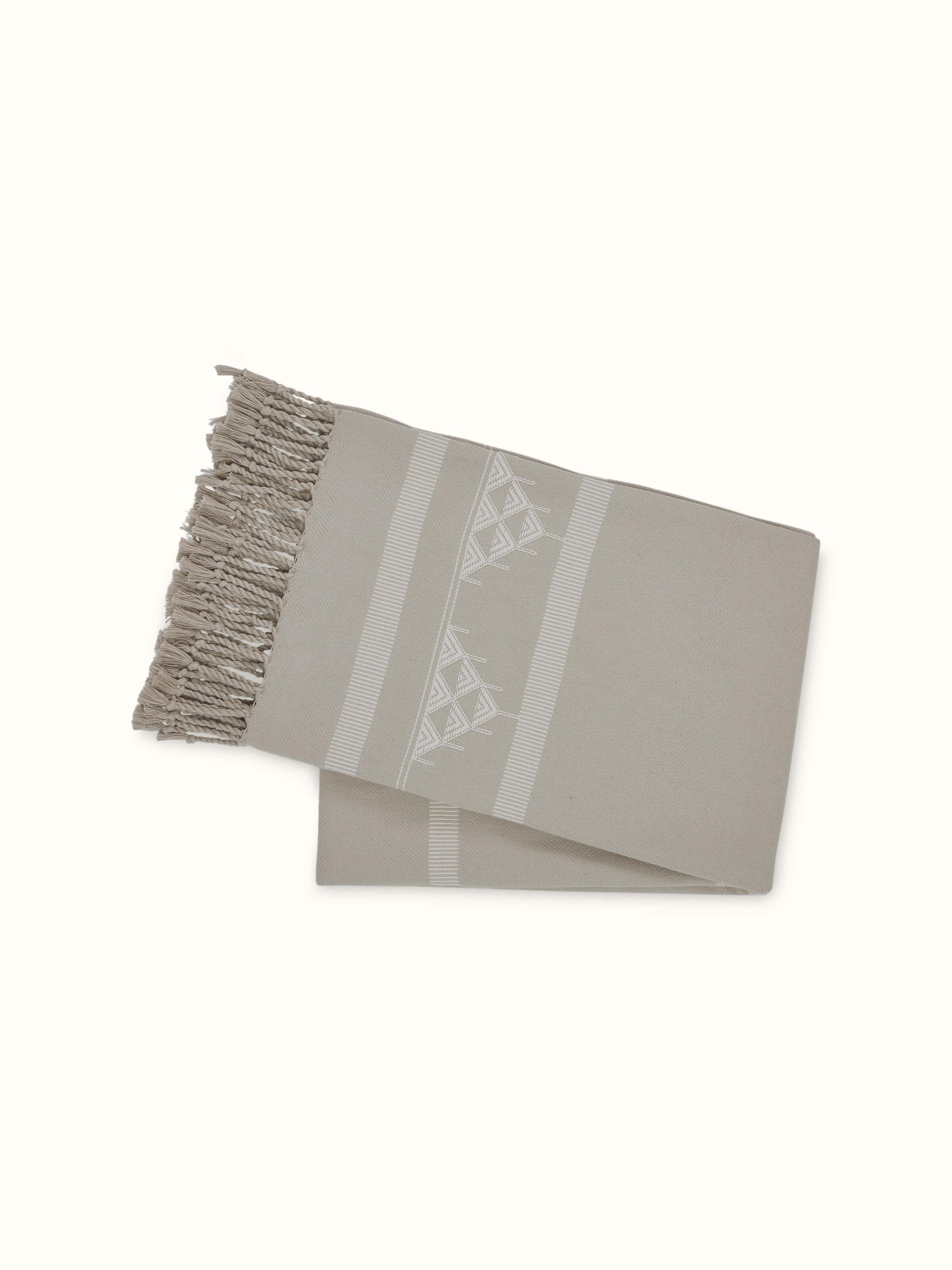 Back view of the Godna beige Pattu throw showcasing the full stripe layout.