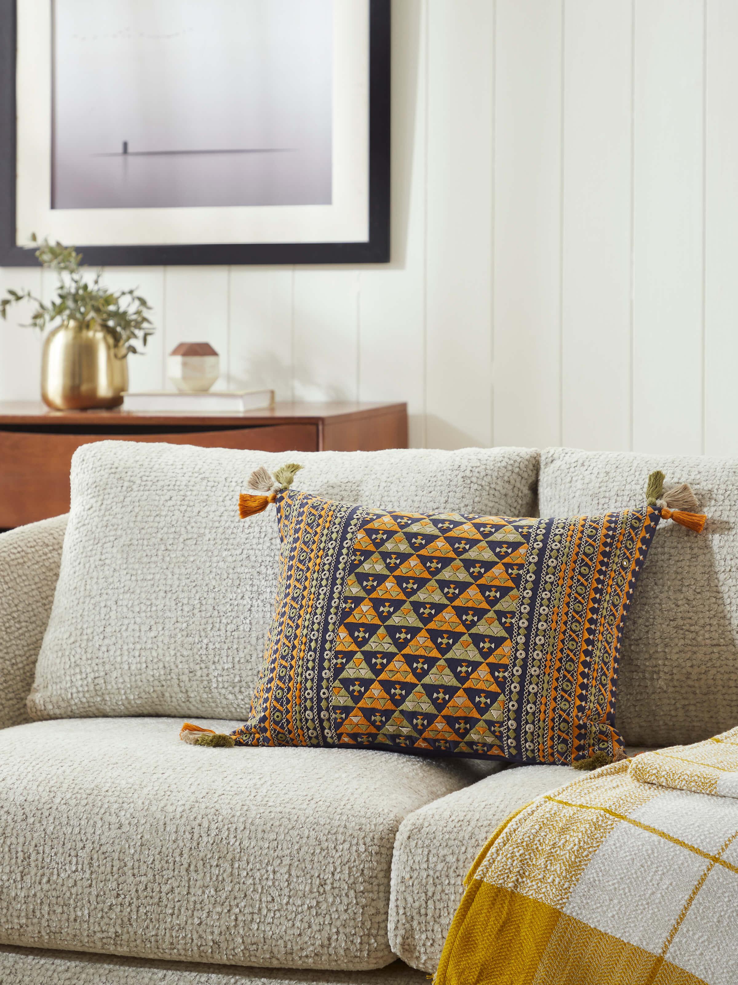 Close-up of Neel blue border cotton casement suf hand embroidered cushion cover showcasing the intricate hand-embroidery and fabric texture
