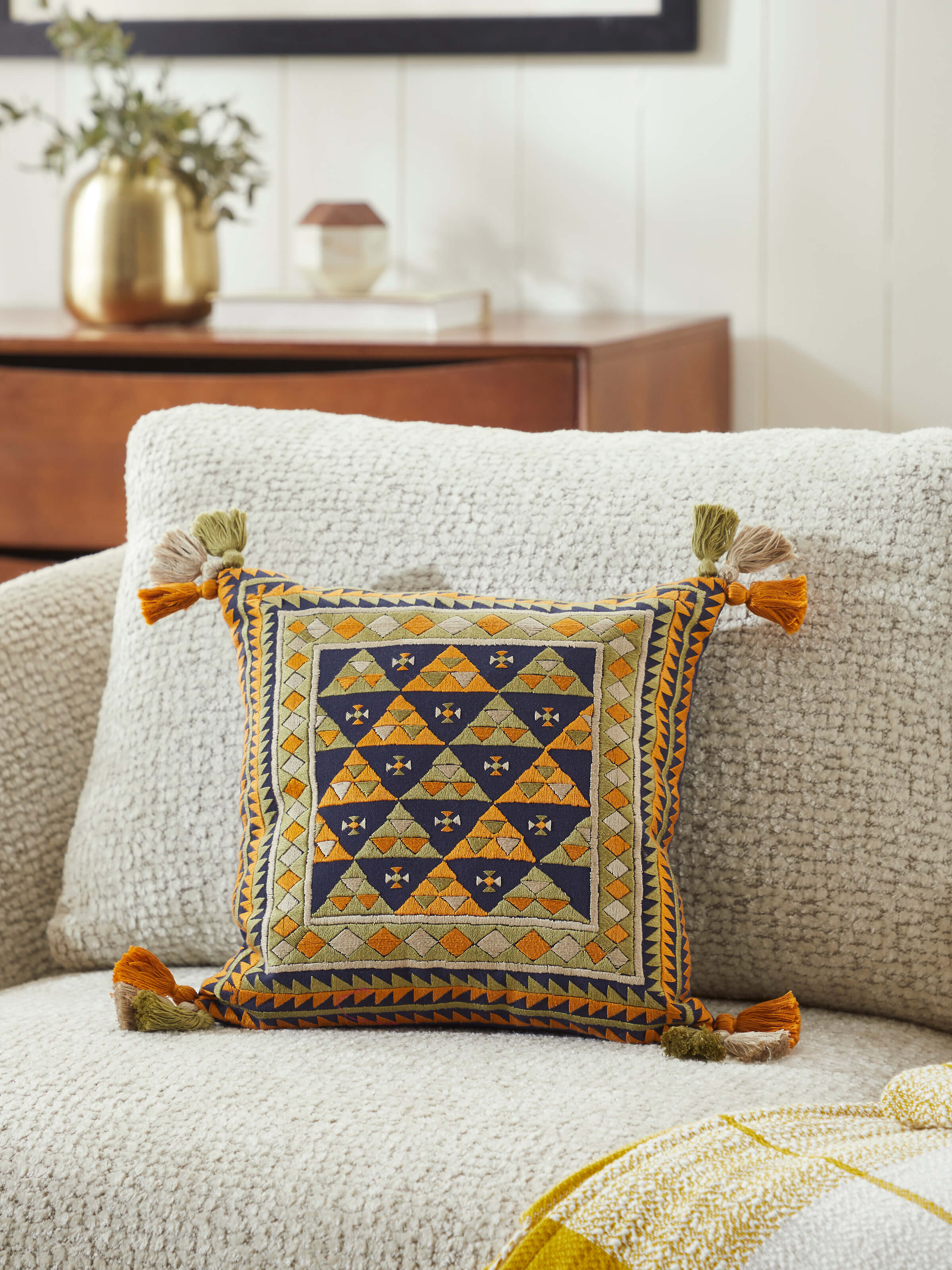 Close-up of Neel blue triangular allover cotton casement suf hand embroidered cushion cover highlighting the detailed embroidery pattern.
