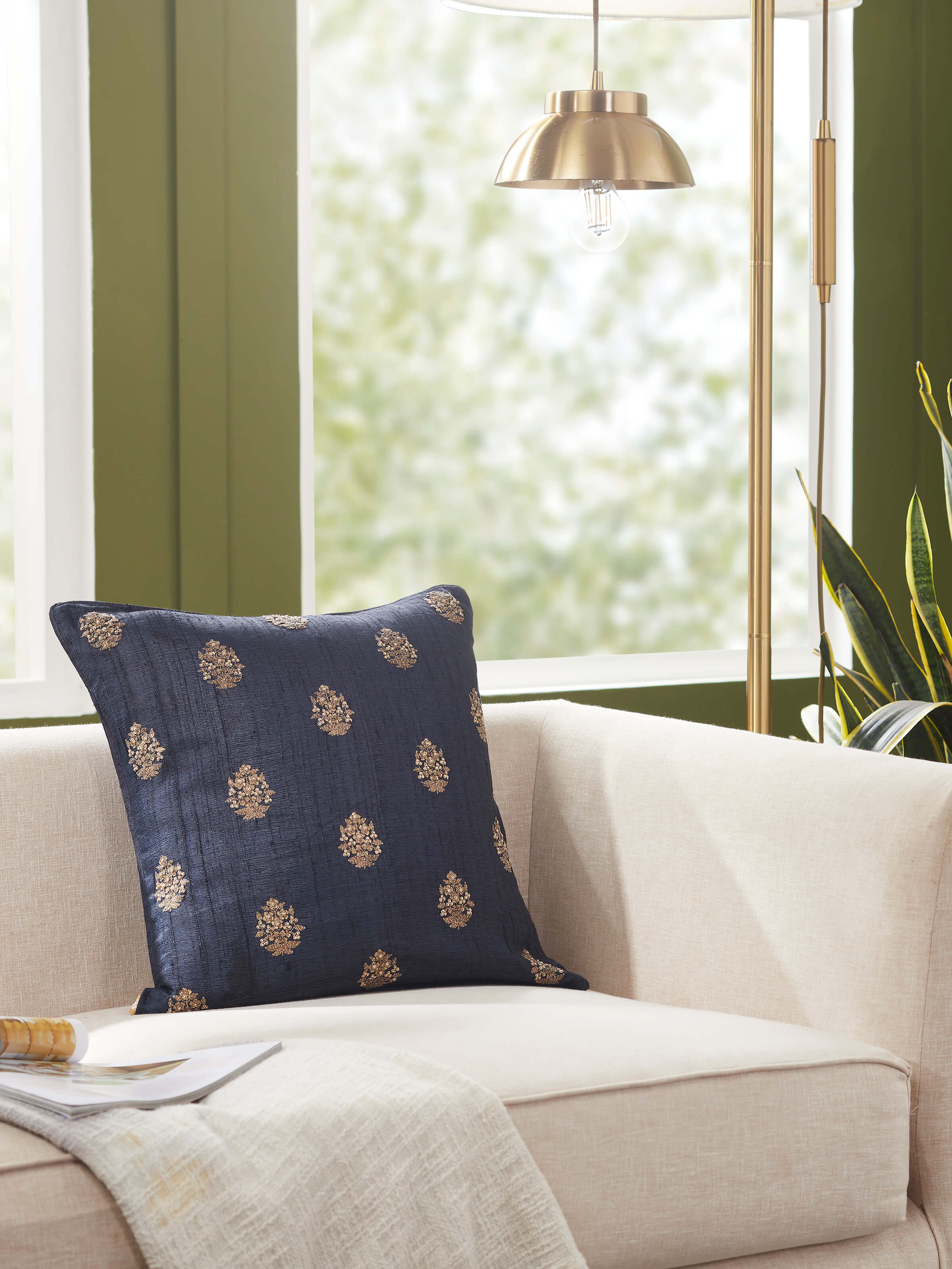 Close-up of Alankar dark blue buti silk zardozi embroidered cushion cover showing embroidery details.