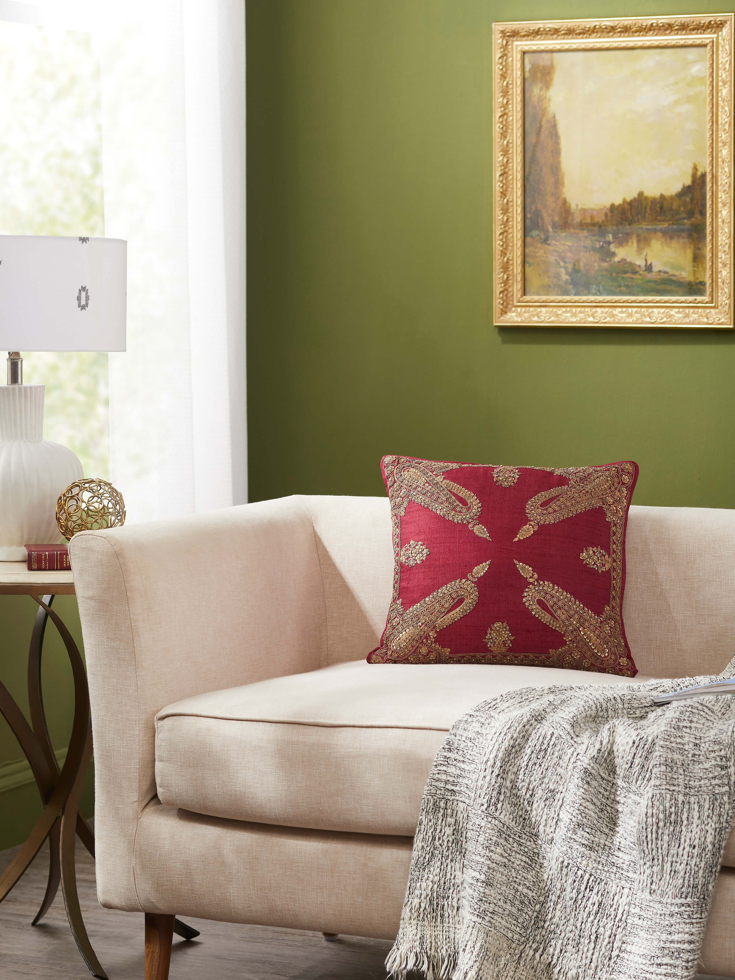 Close-up of Alankar maroon koniya paisley silk zardozi embroidered cushion cover focusing on the zardozi embroidery and silk fabric.