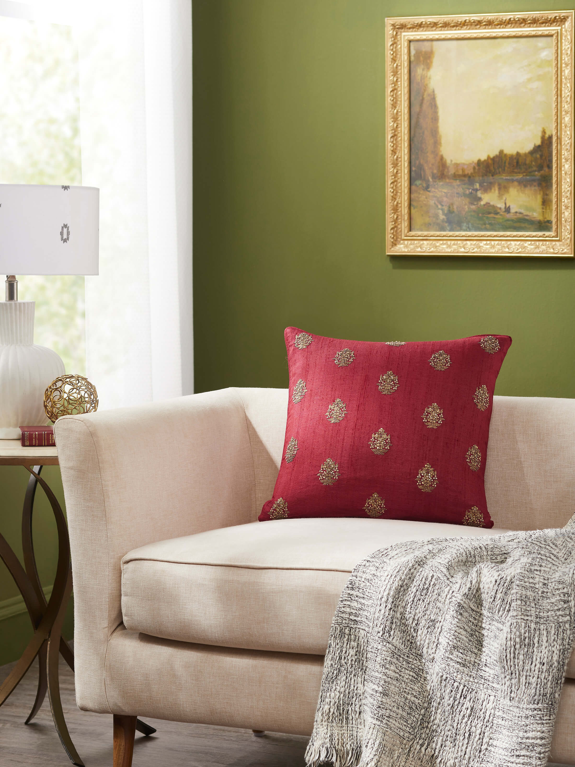 Close-up of Alankar Maroon Buti Silk Zardozi Embroidered Cushion Cover highlighting the detailed silk fabric and embroidery.