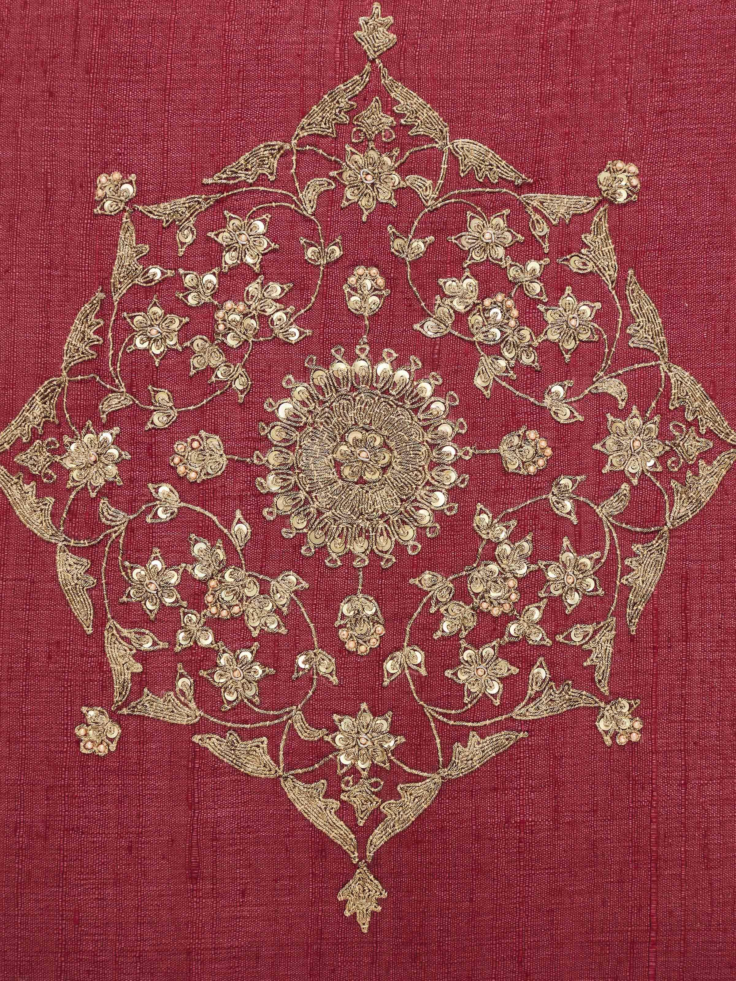 Side view of Alankar maroon buta silk cushion cover emphasizing zardozi embroidery and fabric texture