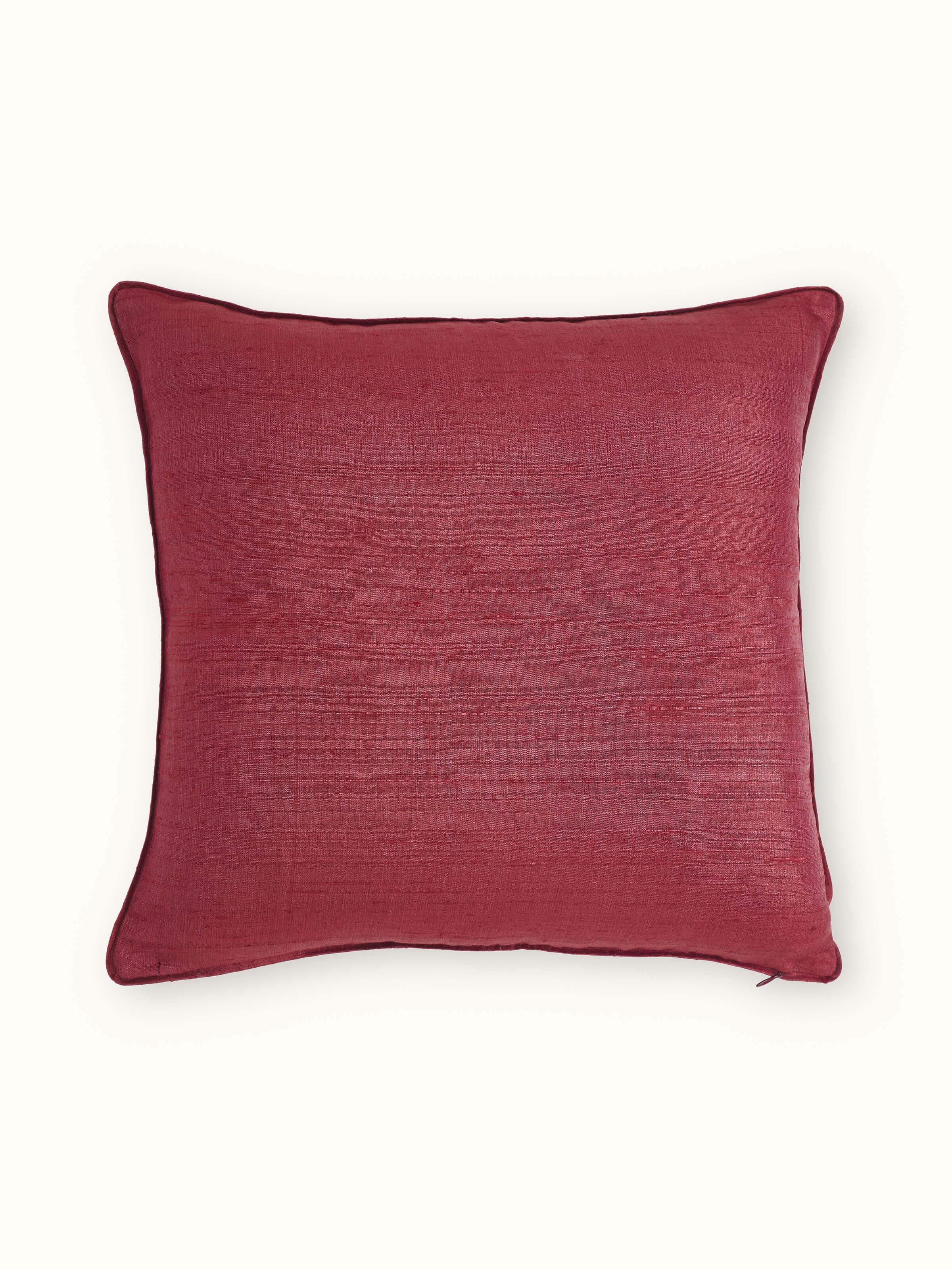 Full view of Alankar maroon buta silk cushion cover with zardozi embroidery in a styled setting