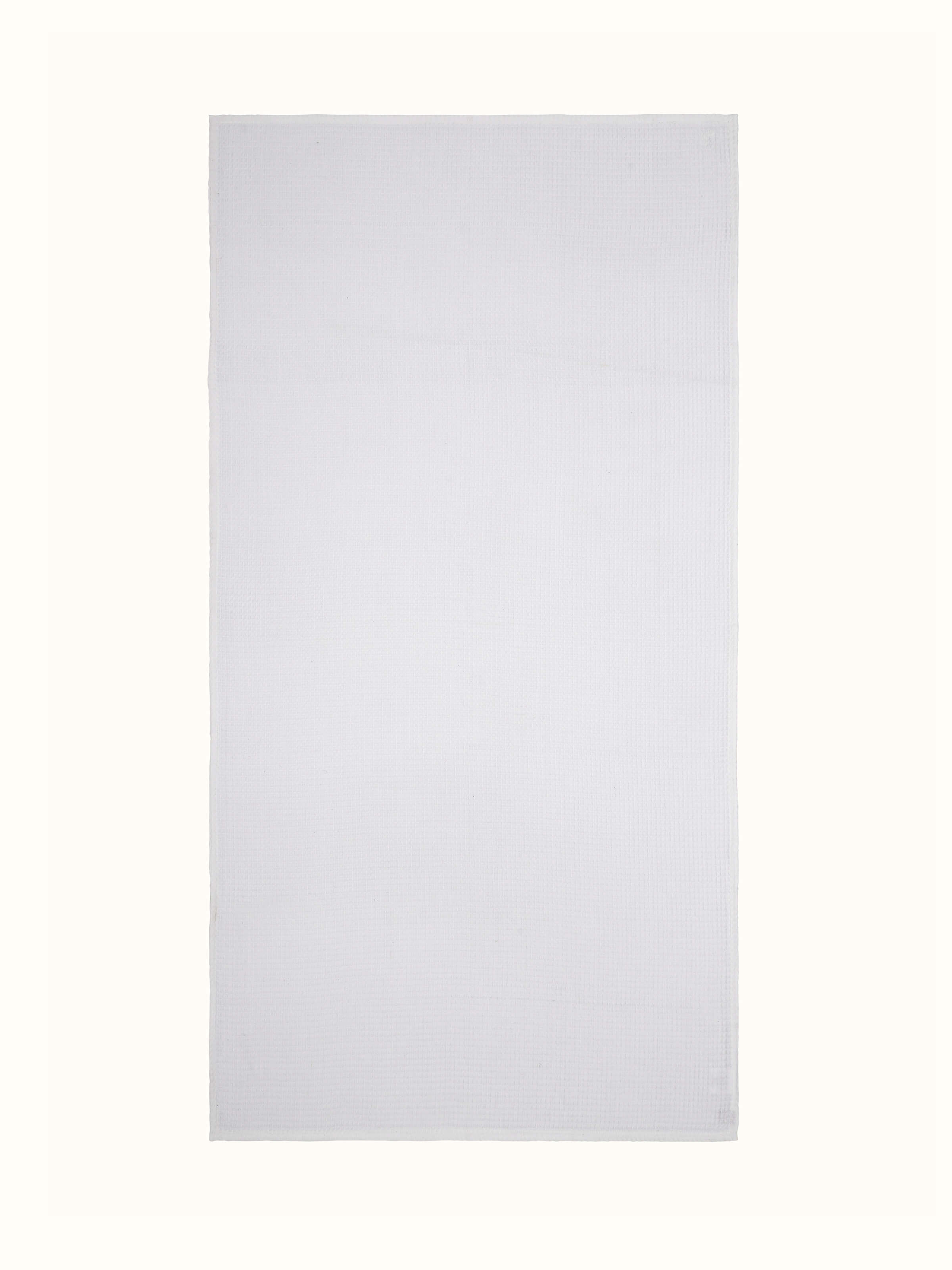 Full view of Amala waffle white solid cotton bath towel showcasing its texture and size