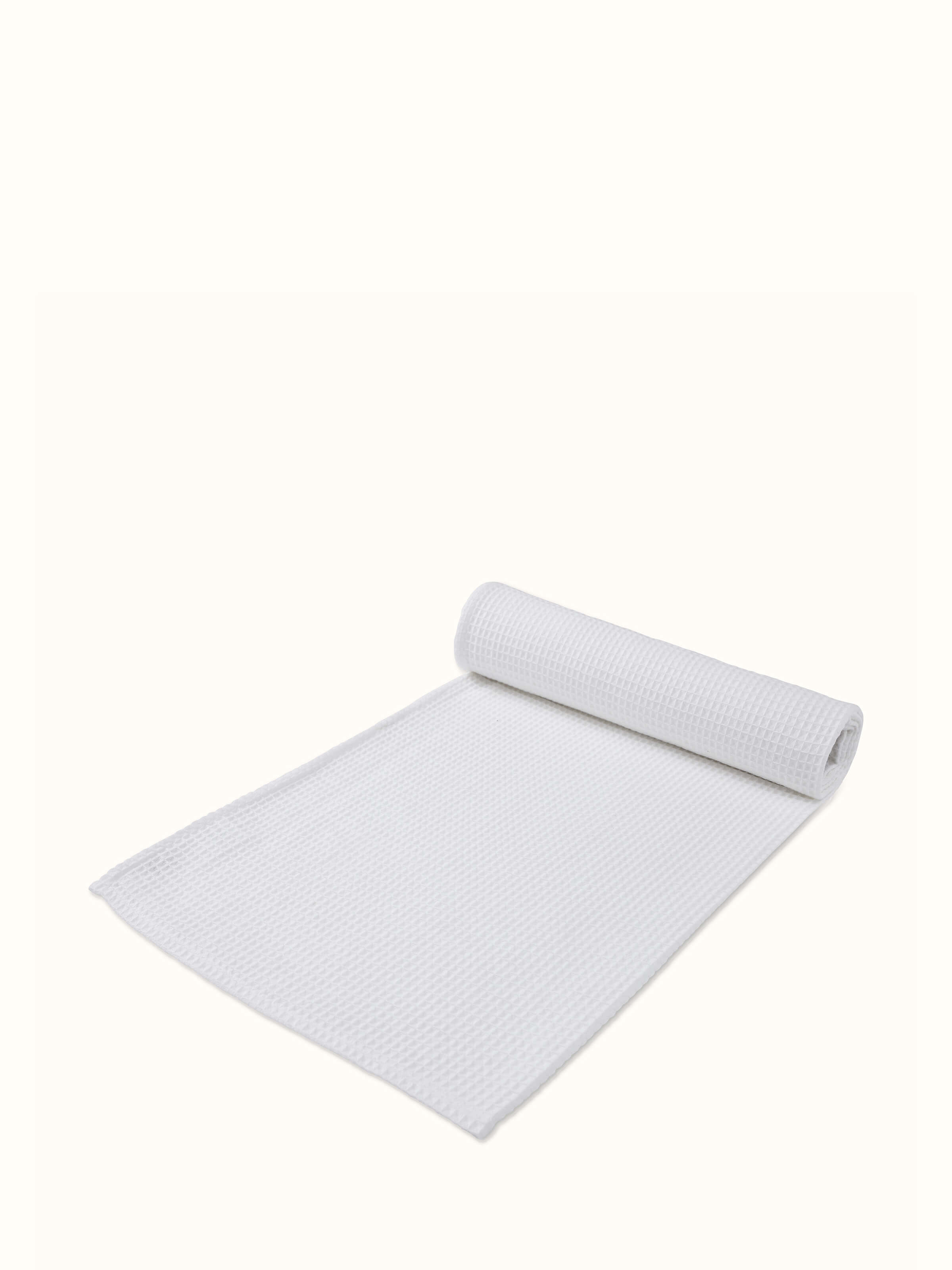 Detailed view of Amala waffle white solid cotton bath towel demonstrating its fabric quality