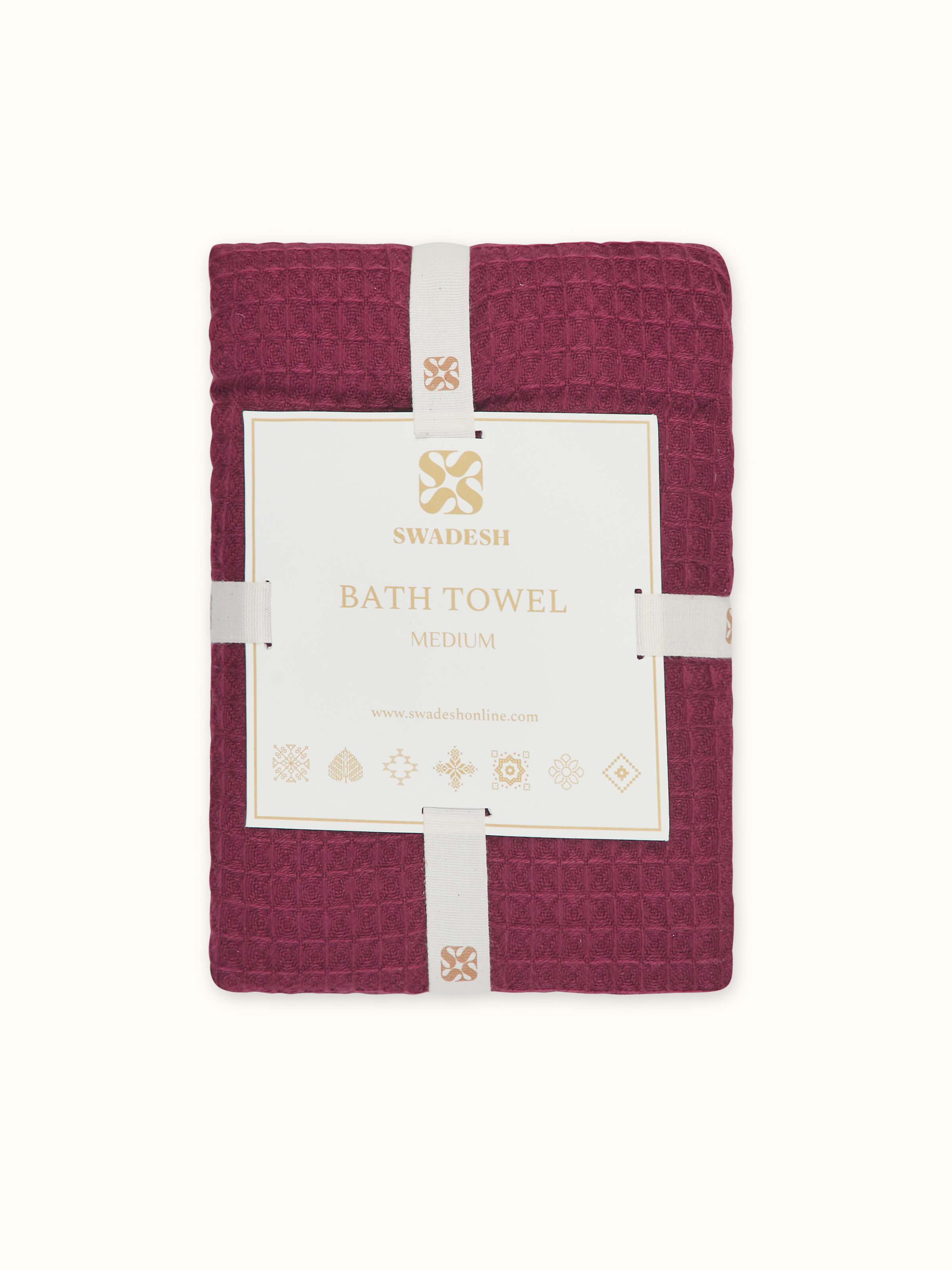 Full view of Amala Waffle Purple Solid Cotton Bath Towel (M), featuring its size and rich purple color.
