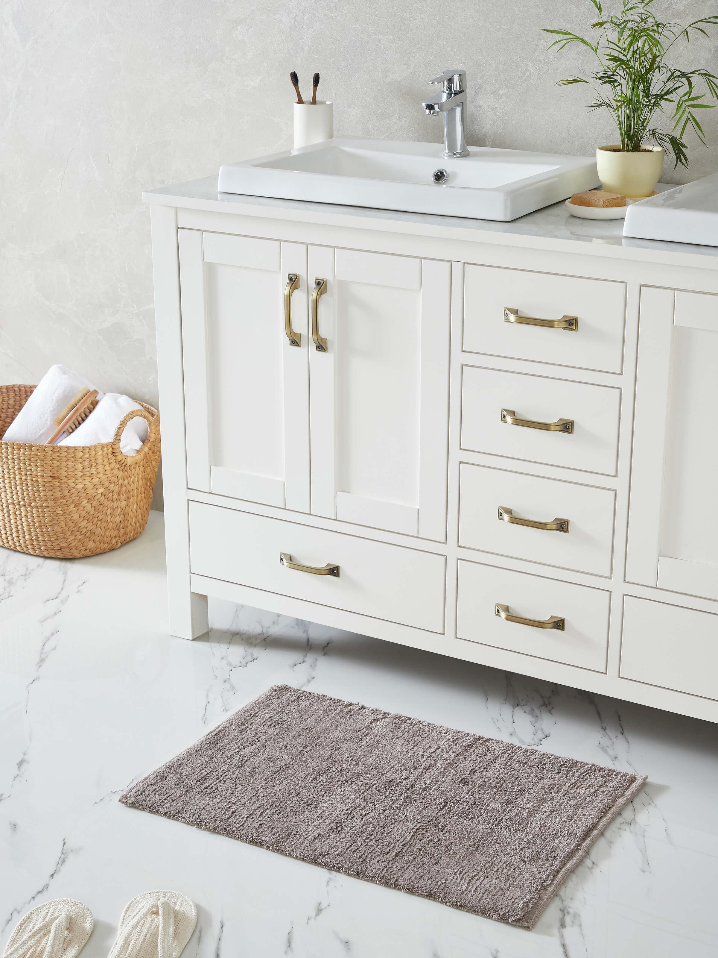 Close-up of Karya solid brown cotton bath mat focusing on the fabric texture and color
