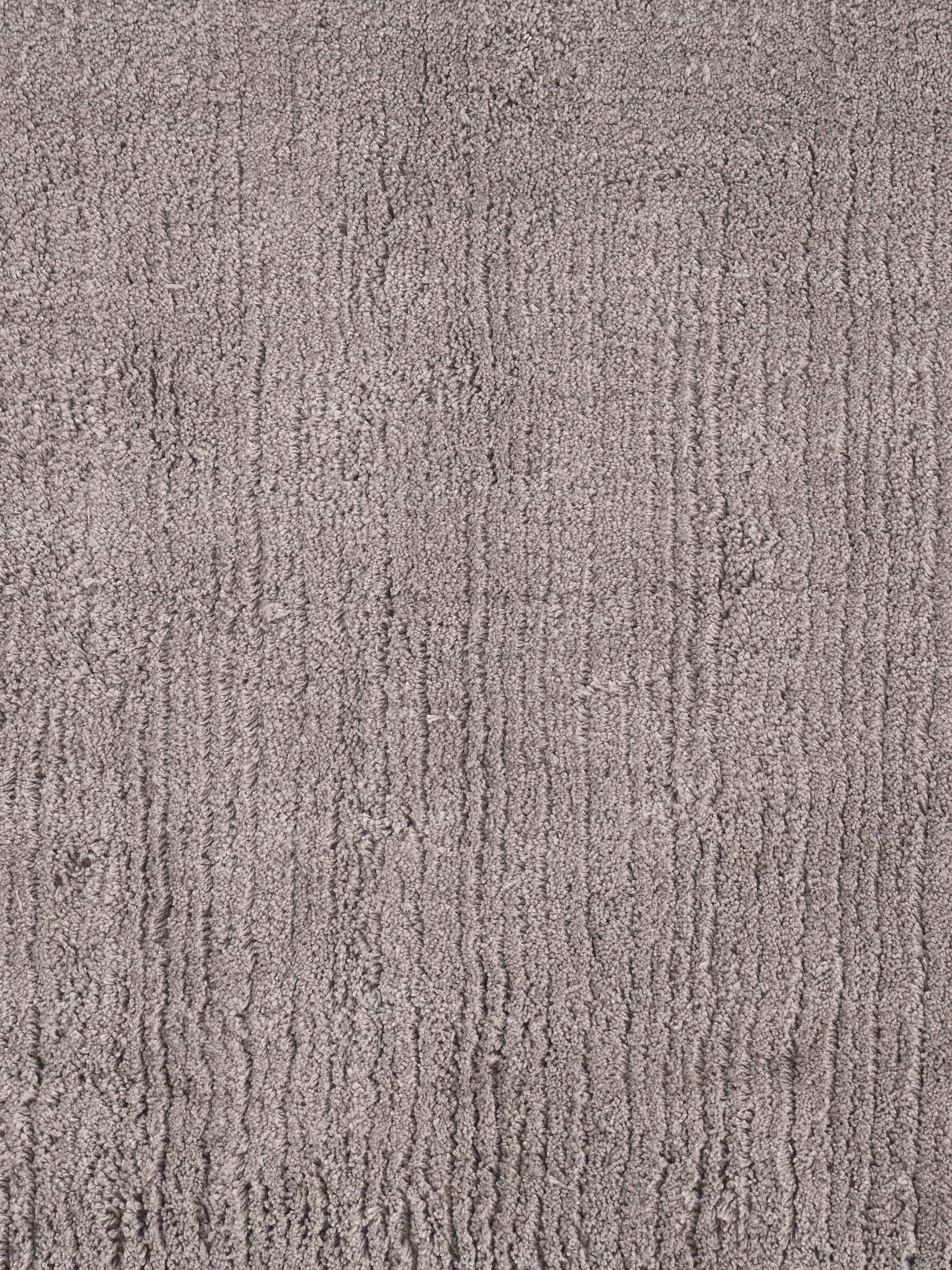 Detailed view of Karya solid brown cotton bath mat highlighting its thickness and plush texture
