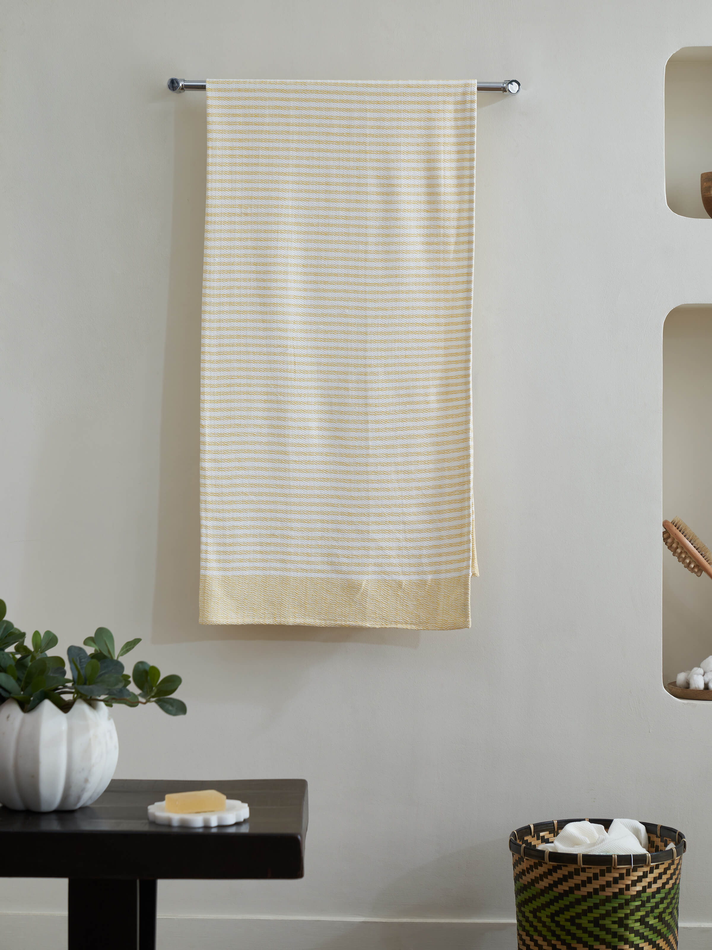 Close-up of Vayana solid yellow cotton bath towel (XL) highlighting the soft cotton texture and vibrant yellow shade