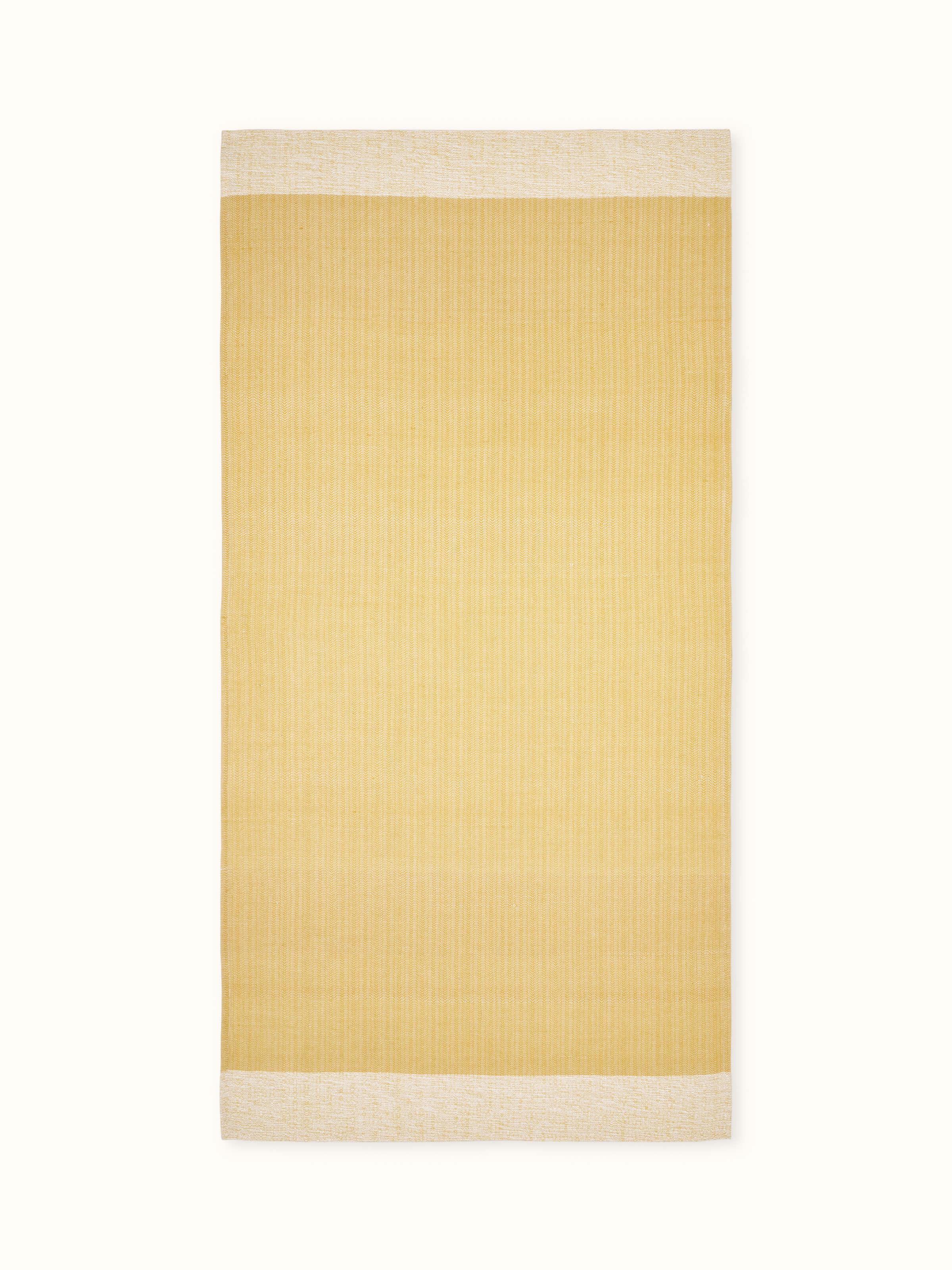 Full view of Vayana solid yellow stripe cotton bath towel (L) showing its bright yellow color and stripe design