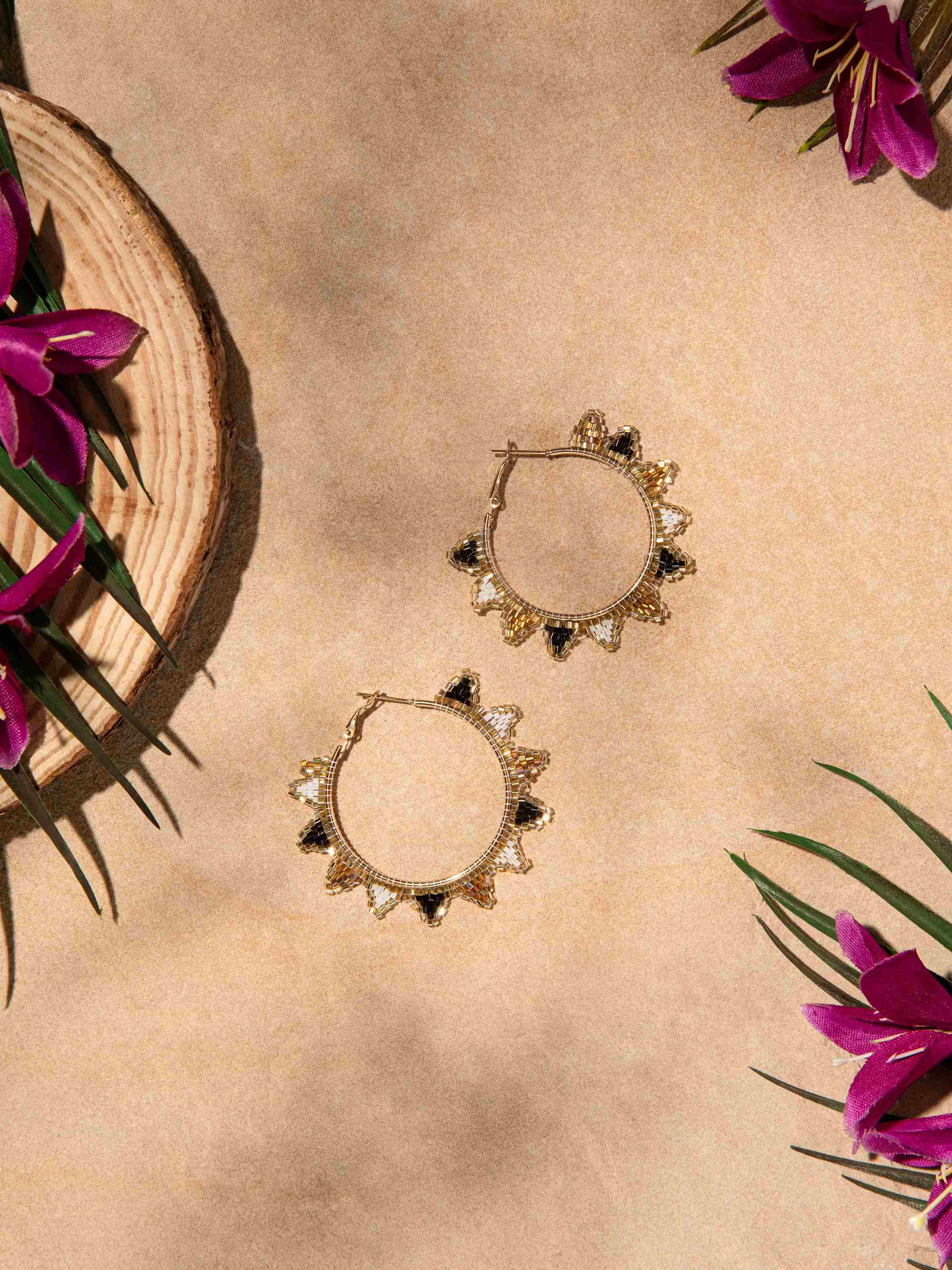 Close-up view of Handcrafted Hoop Earrings highlighting detailed metalwork.