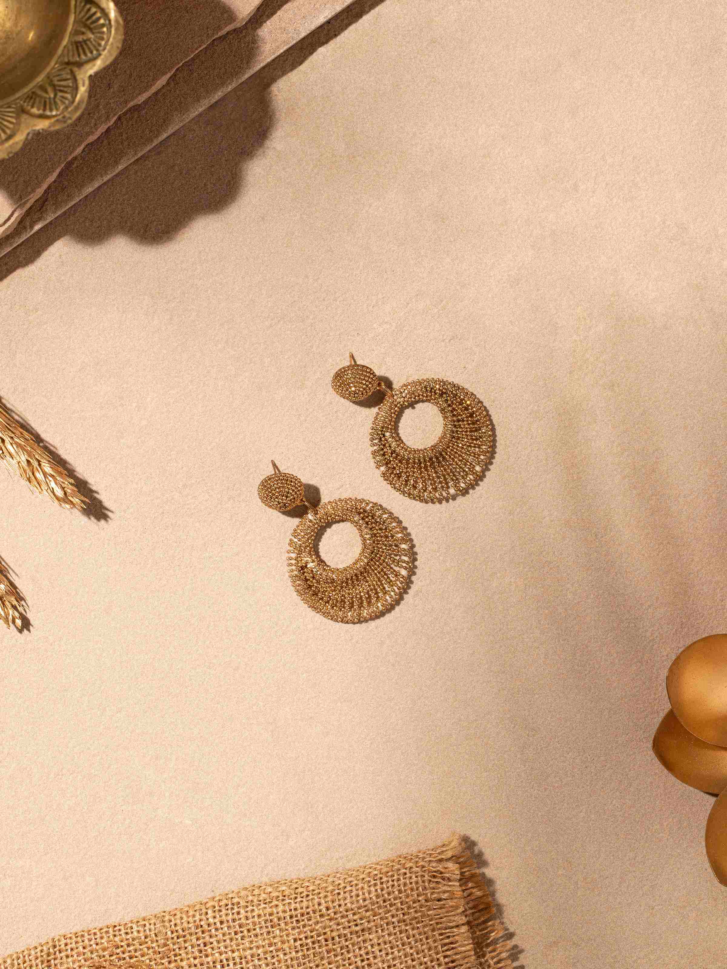 Close-up view of Handcrafted drop earrings emphasizing fine details and artistic design