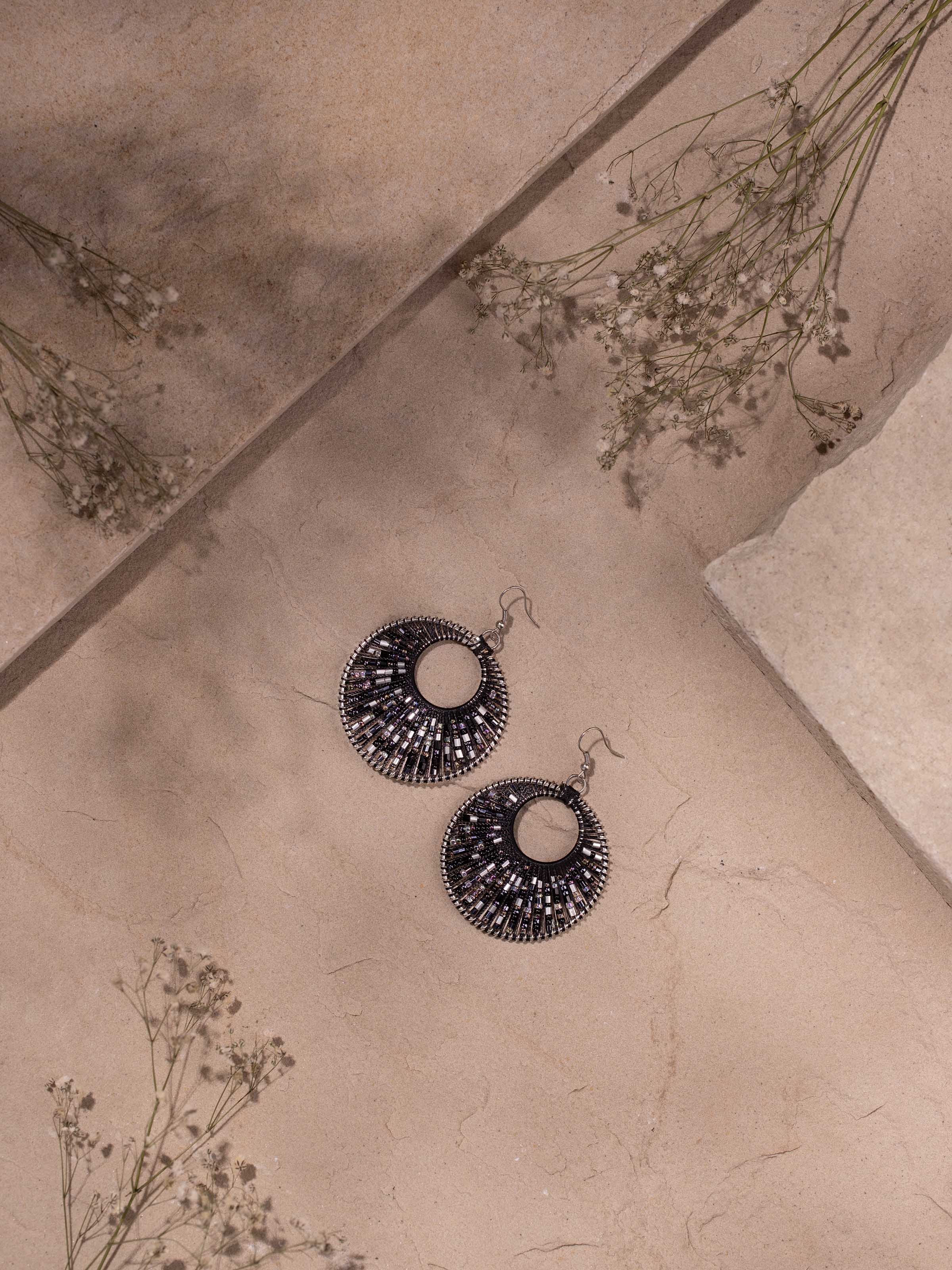 Close-up of Handcrafted drop earrings highlighting fine detailing and unique design