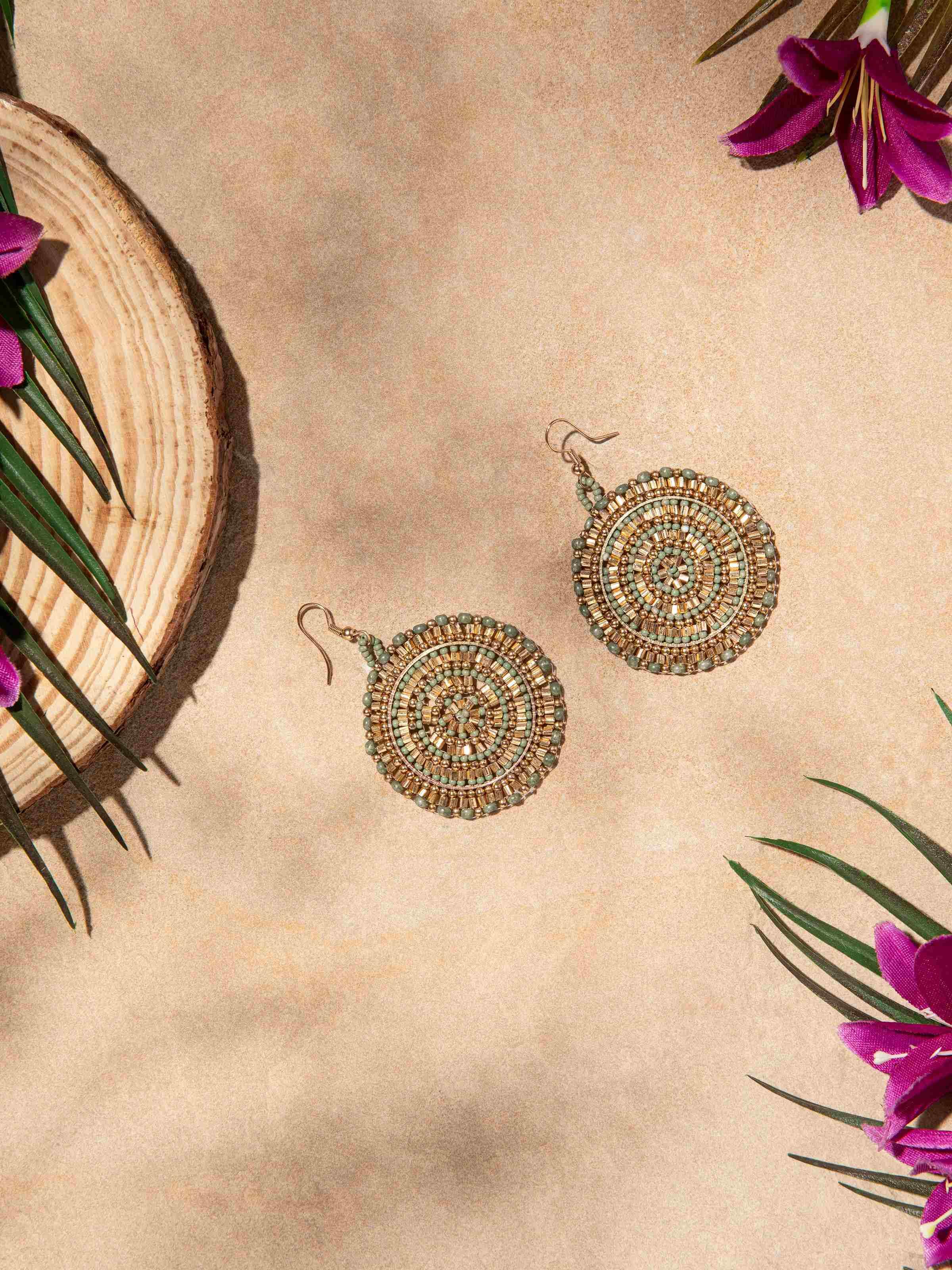 Side view of handcrafted drop earrings highlighting the elegant profile and craftsmanship.