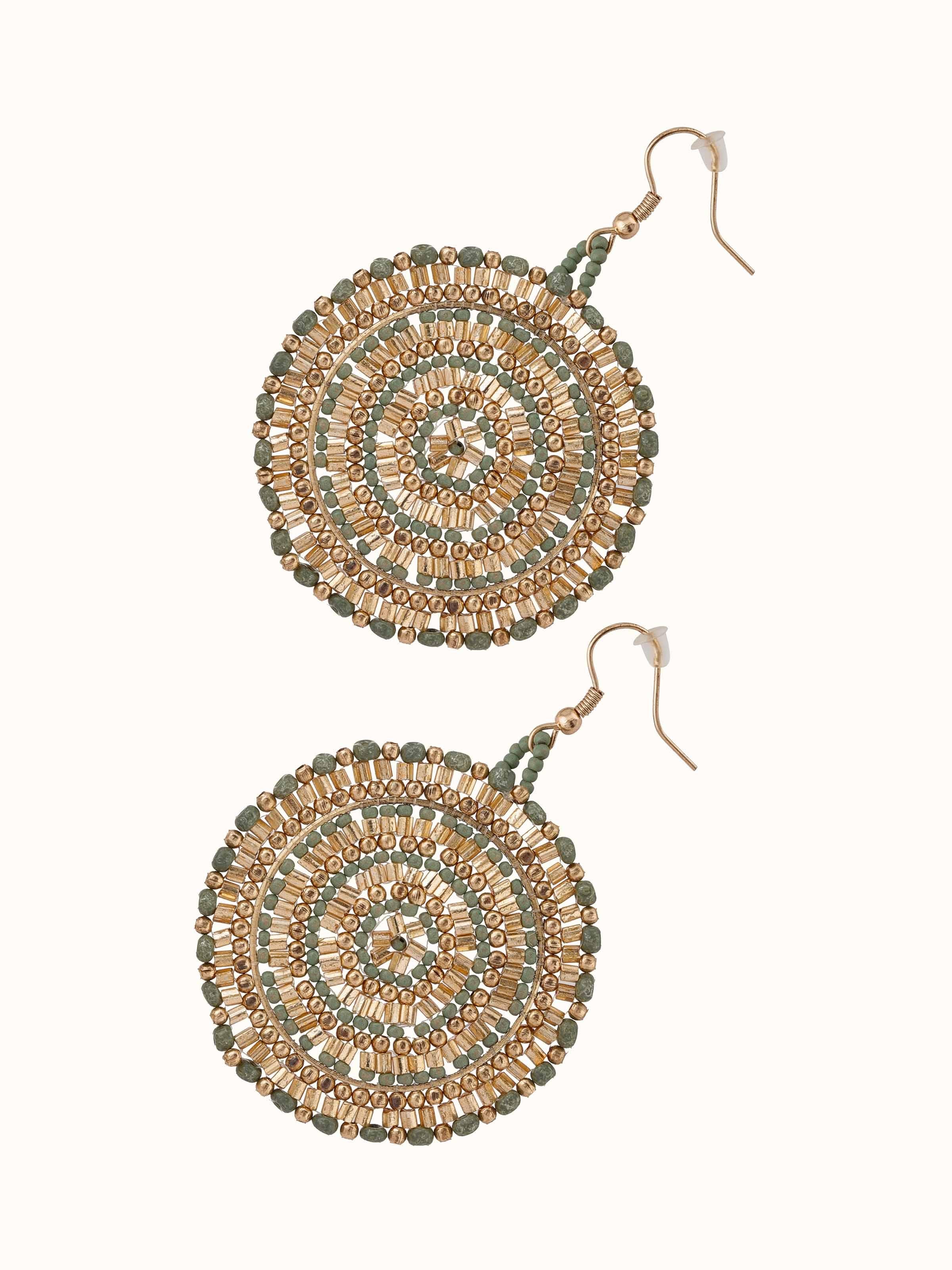 Detailed view of handcrafted drop earrings emphasizing the fine craftsmanship and design intricacies.