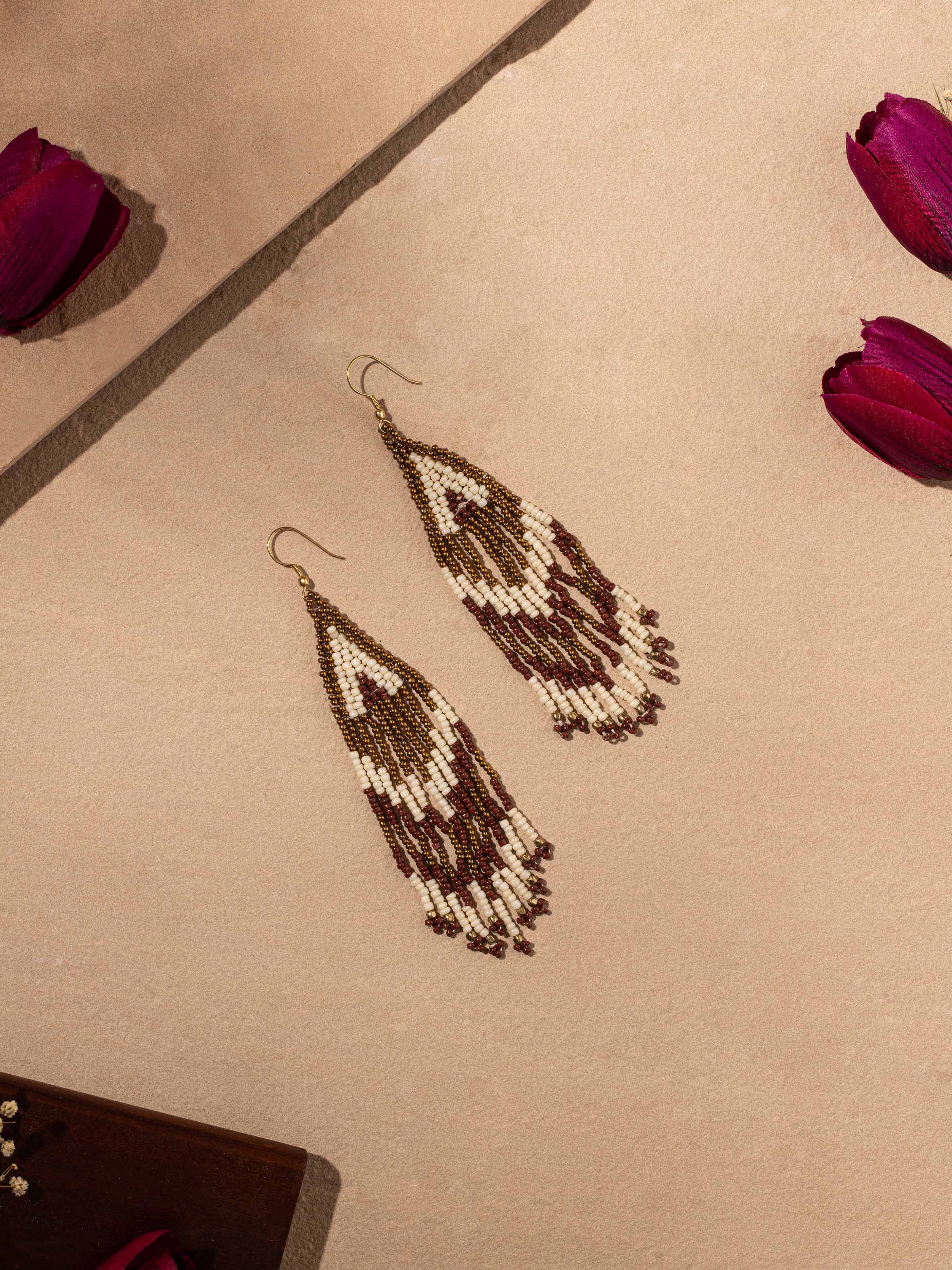 Close-up of handcrafted drop earrings showcasing artisanal craftsmanship.