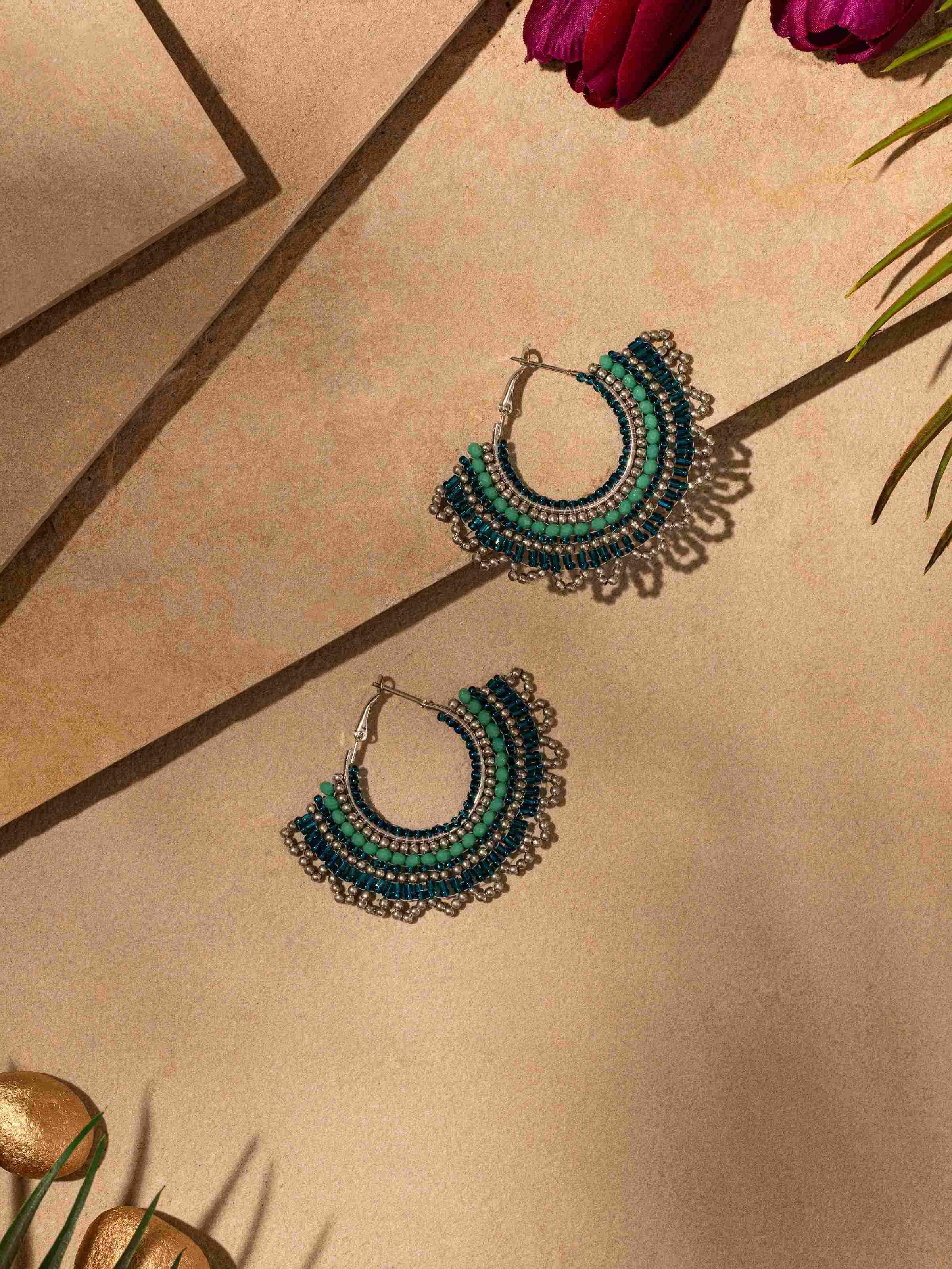 Close-up of Handcrafted Hoop Earrings focusing on their detailed metalwork and stylish appearance.