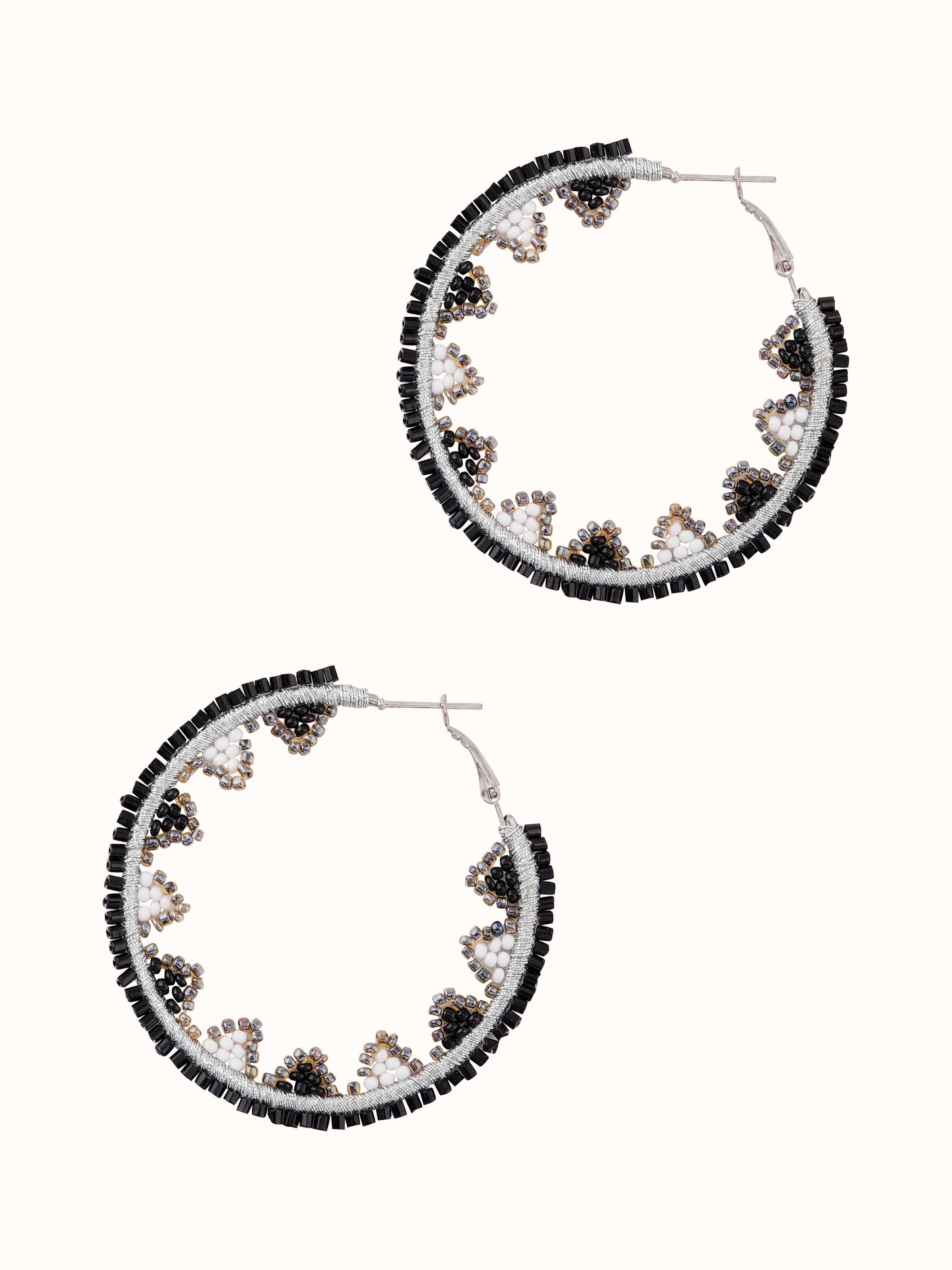 Detailed view of handcrafted hoop earrings with elegant design elements