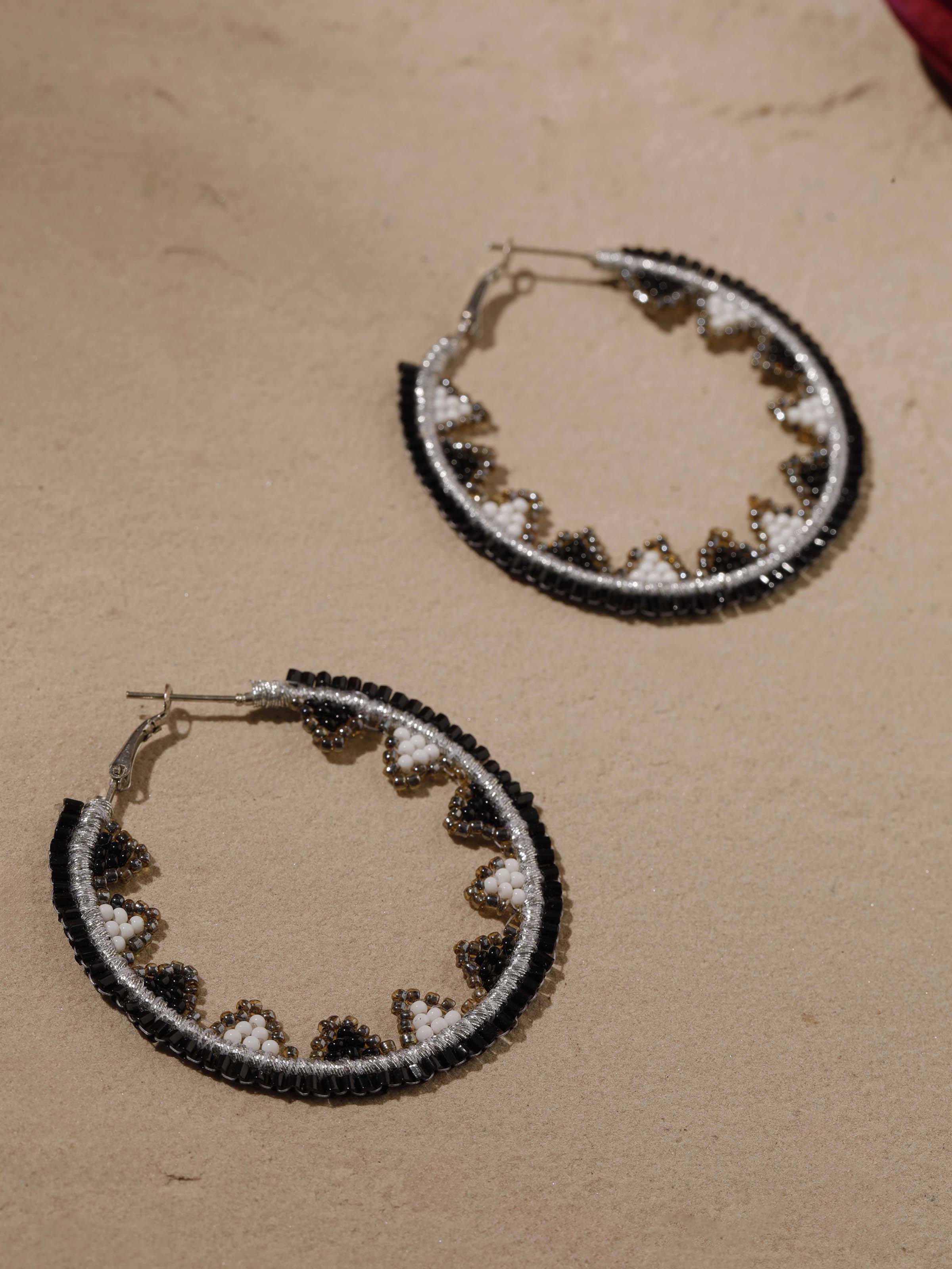 Artistic view of handcrafted hoop earrings featuring unique pattern and craftsmanship