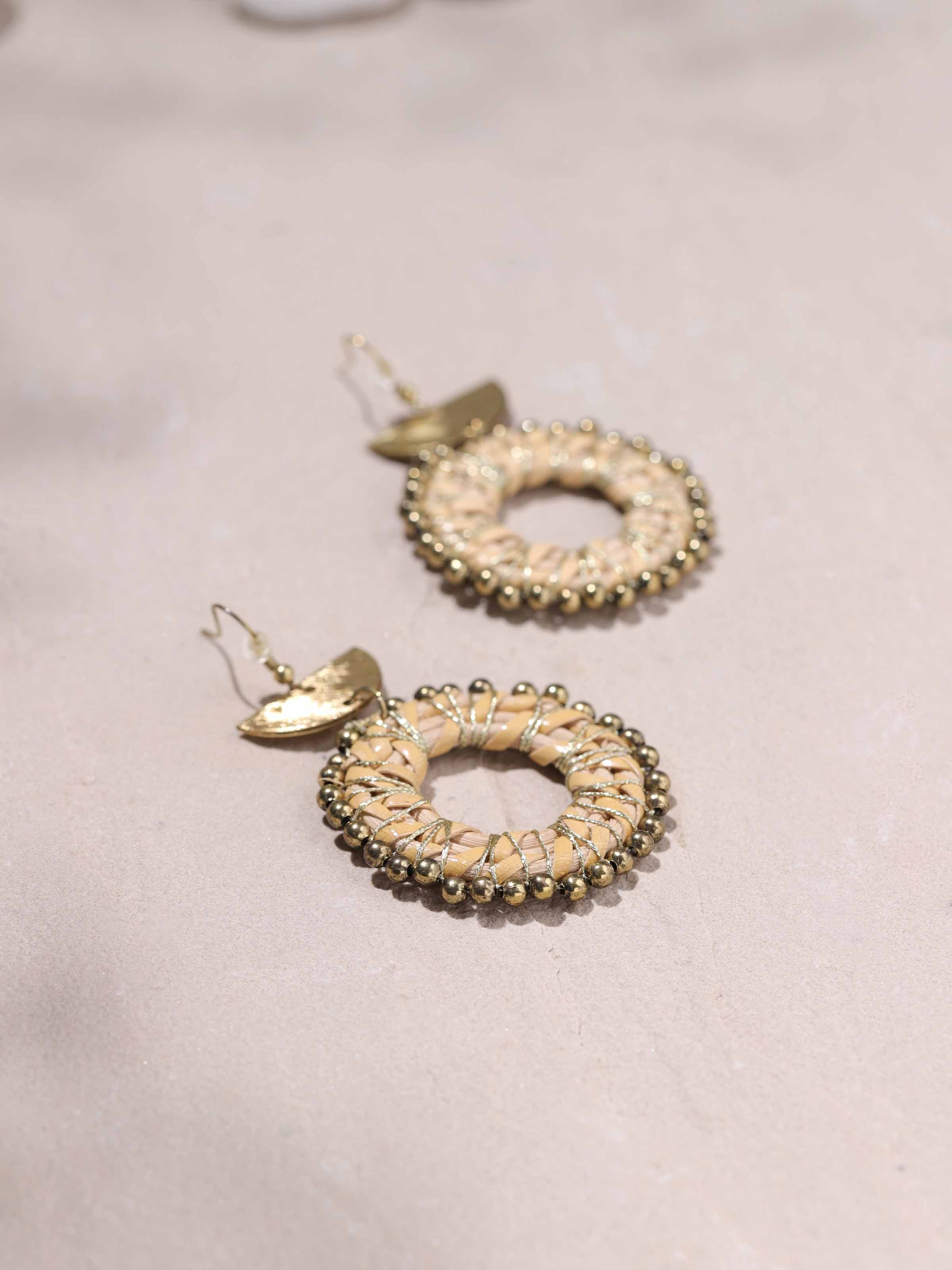 Detailed view of Handcrafted Drop Earrings from a distance showcasing their full design.