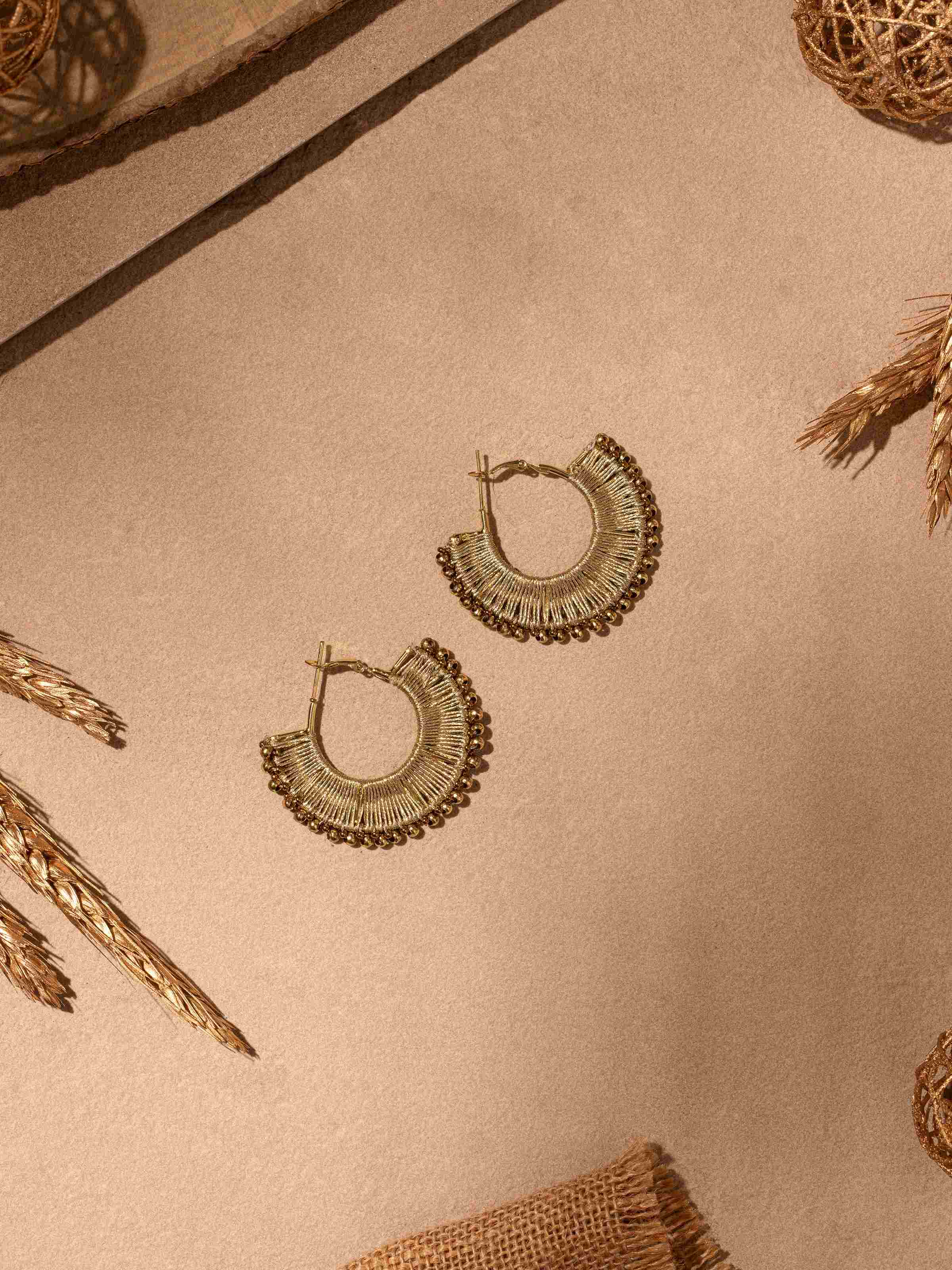 Close-up view of Handcrafted Hoop Earrings focusing on intricate design details and craftsmanship.