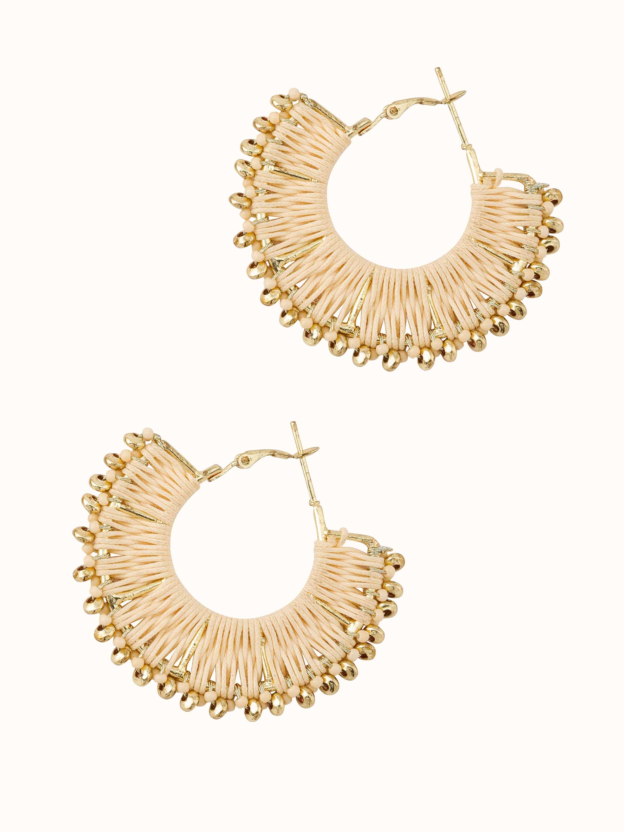 Angled view of Handcrafted hoop earrings emphasizing their stylish shape and detailed work