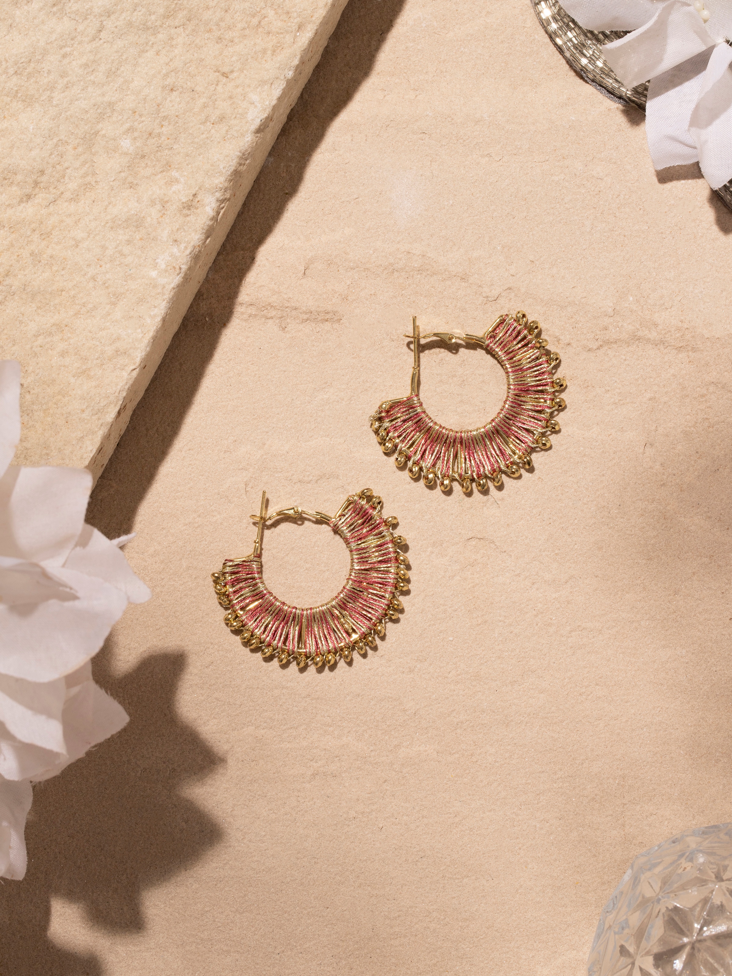 Close-up view of Handcrafted Hoop Earrings highlighting intricate metalwork.