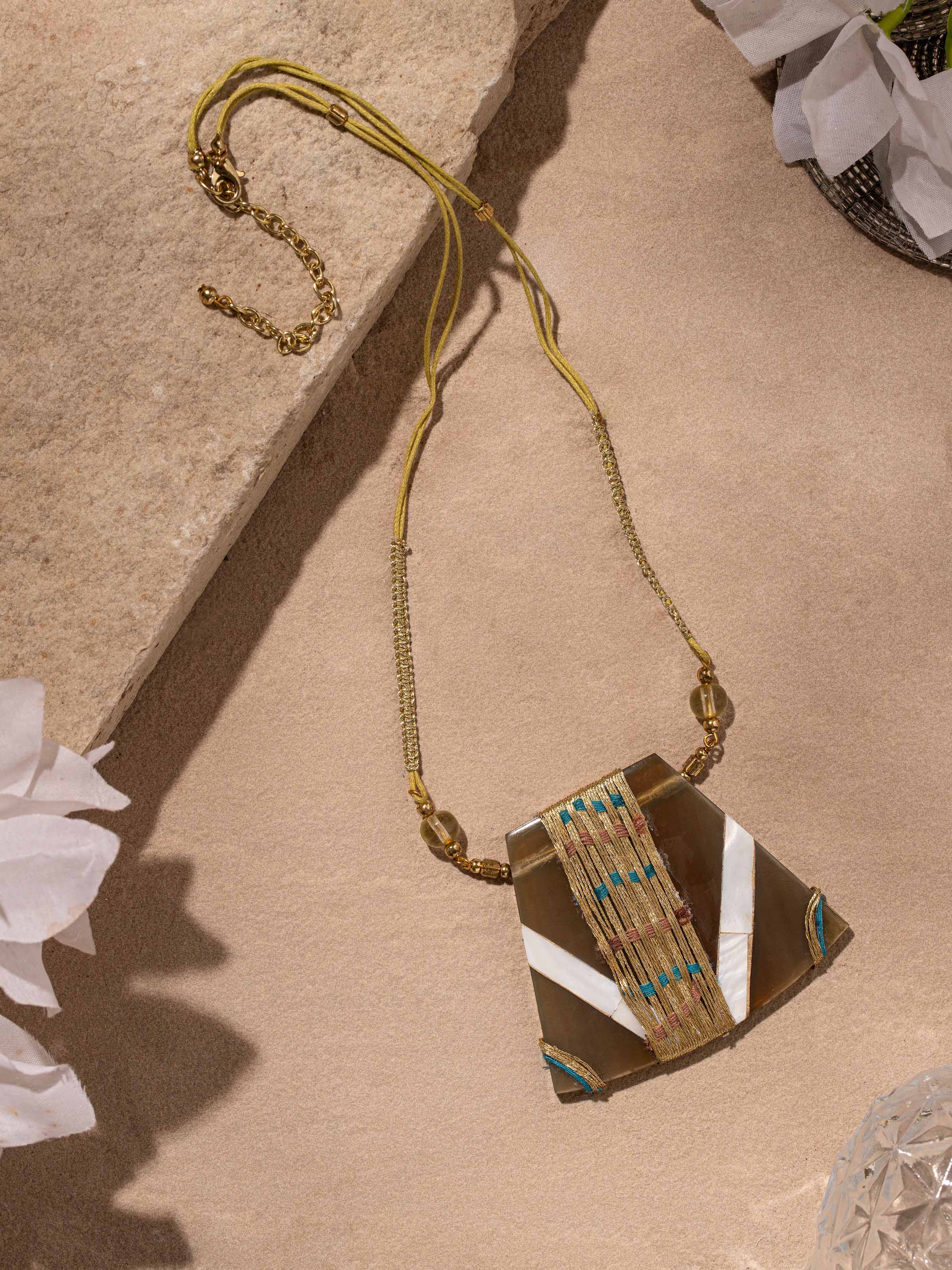 Close-up of handcrafted long necklace highlighting the intricate detailing and high-quality materials.