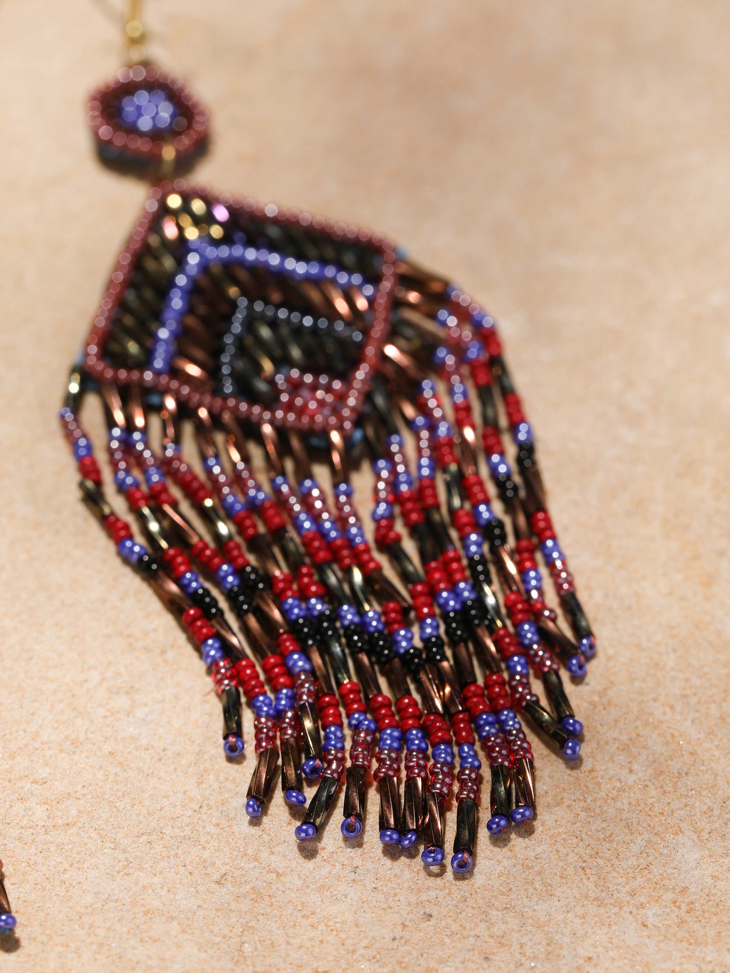 Back view of Handcrafted Drop Earrings featuring secure clasp and smooth design.