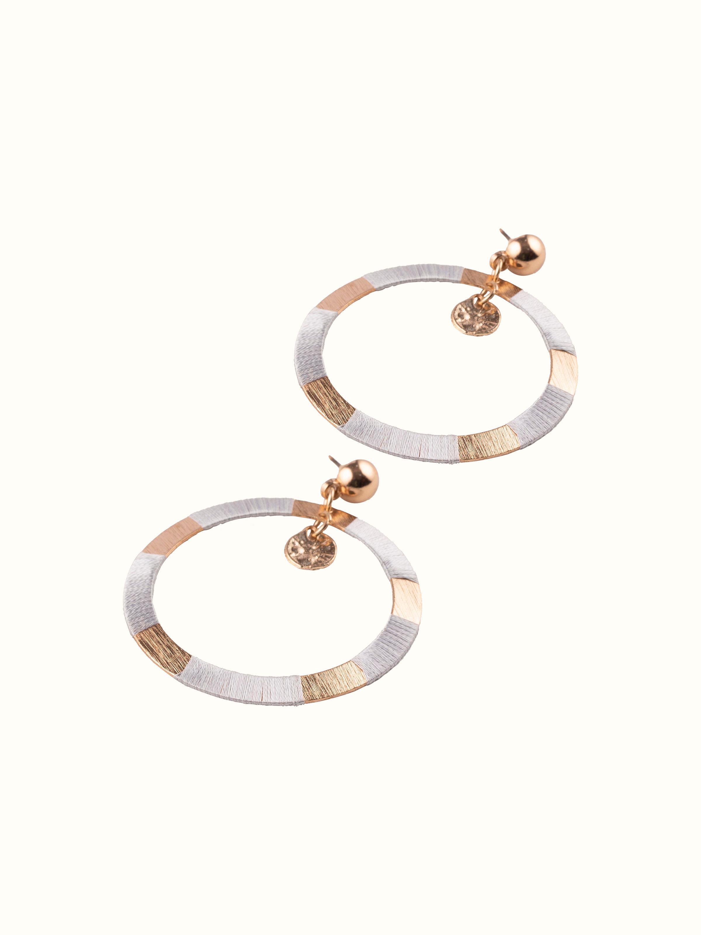Angled view of Handcrafted Drop Earrings emphasizing intricate design elements.
