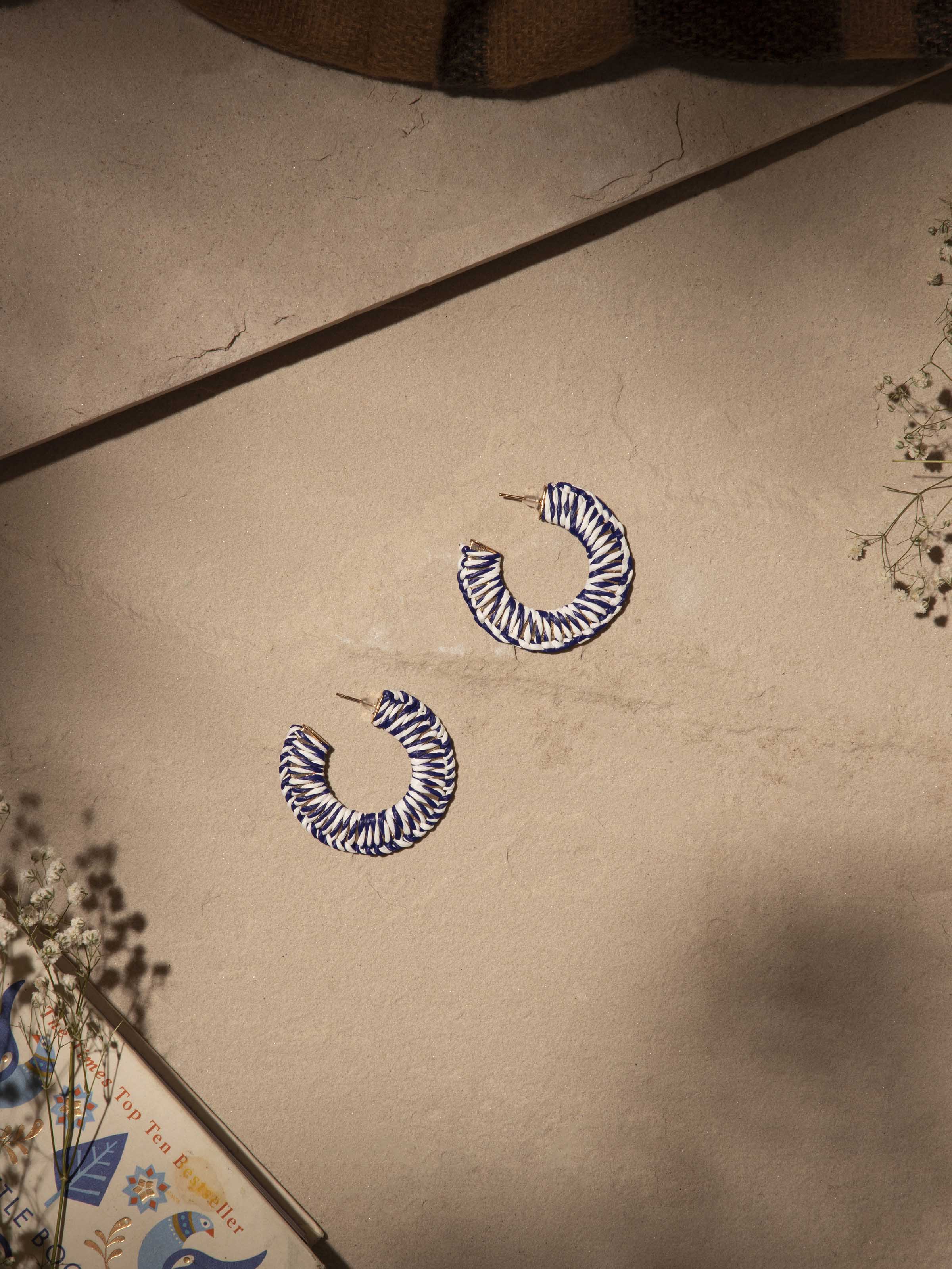 Close-up view of Handcrafted Hoop Earrings featuring fine metal detailing and elegant hoop design.