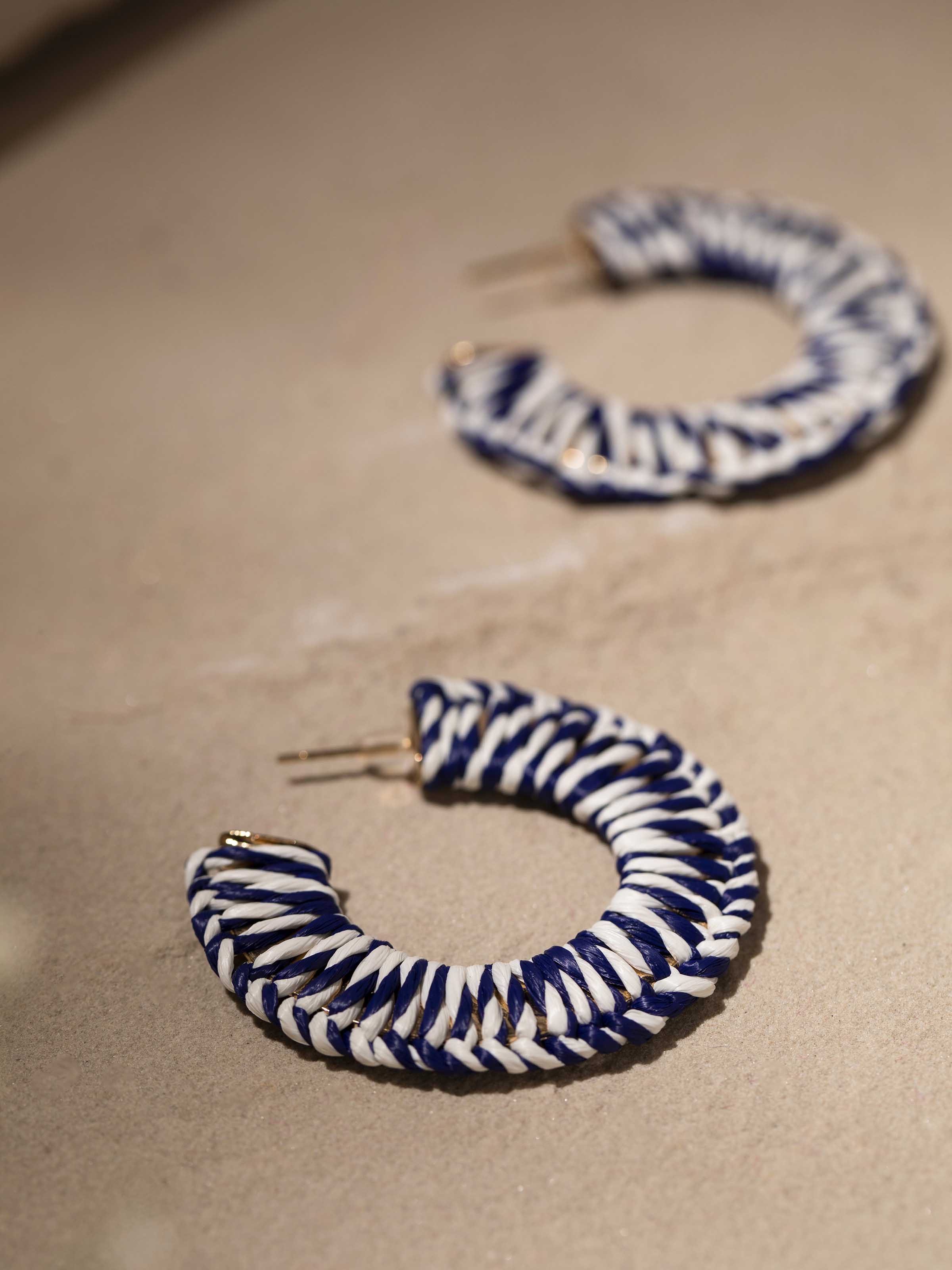 Overhead view of Handcrafted Hoop Earrings showcasing the elegant hoop shape and intricate metal design.