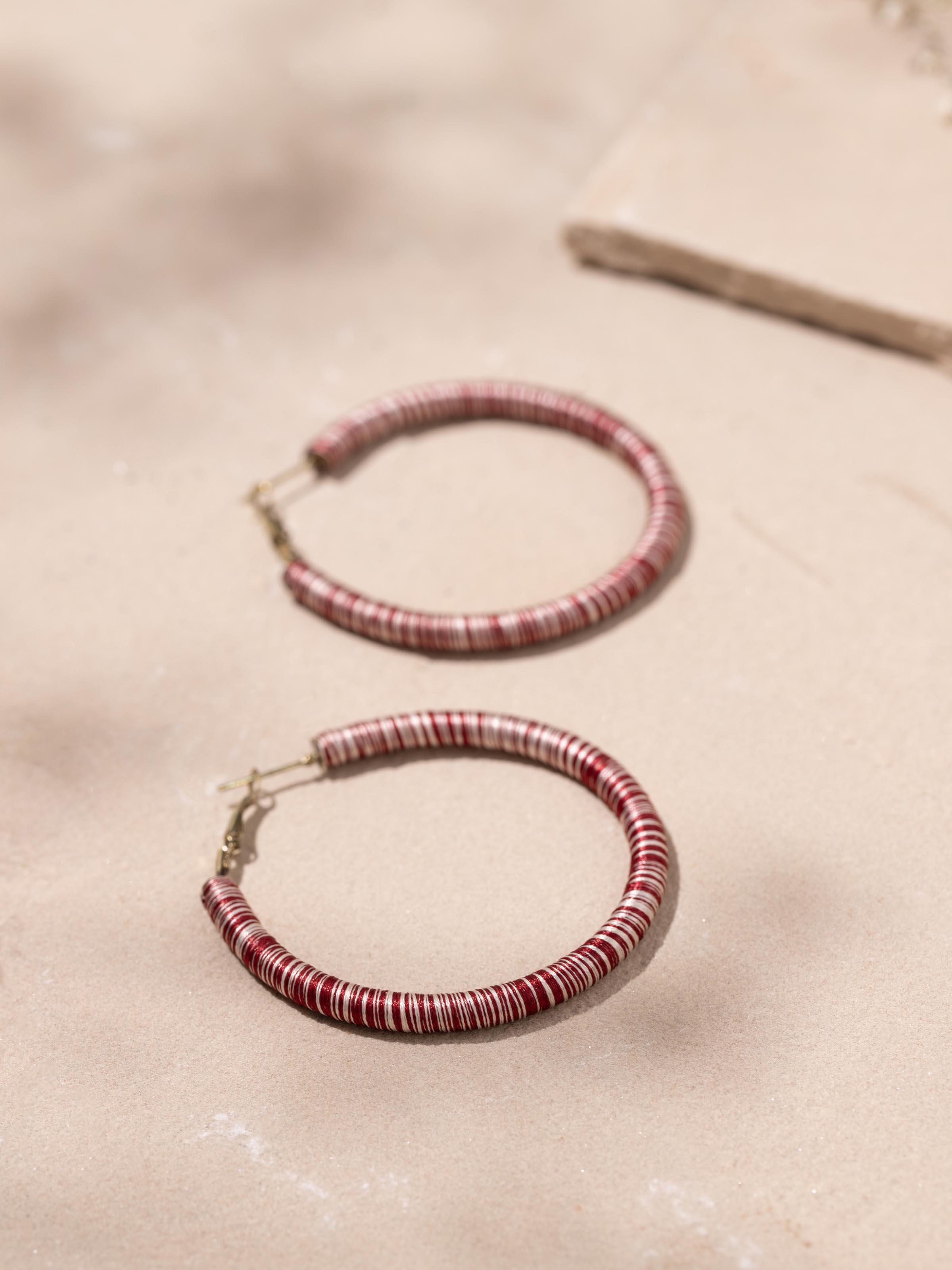 Detailed view of Handcrafted Hoop Earrings from a distance to showcase their full design.