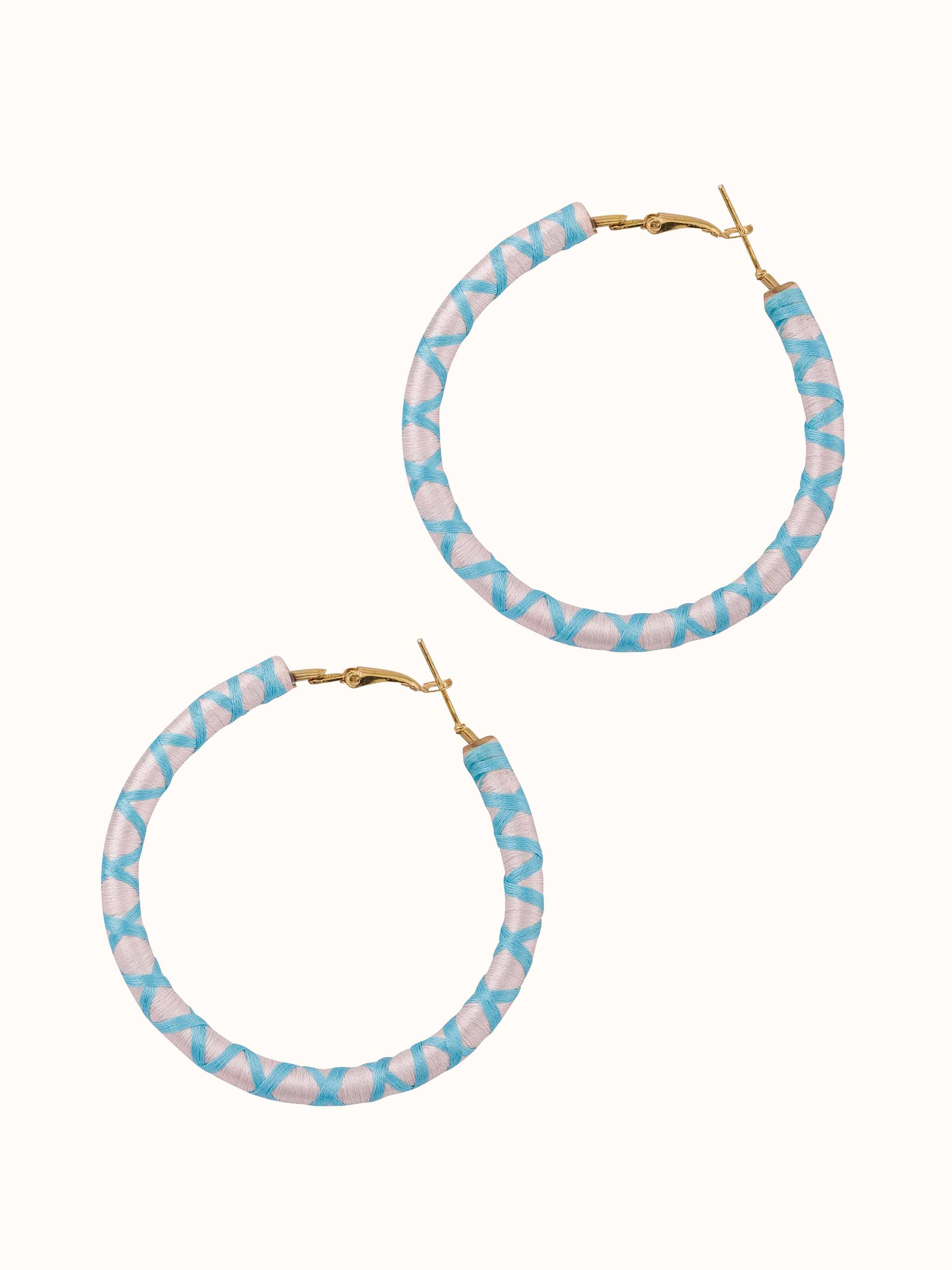 Overhead view of handcrafted hoop earrings showing their full hoop design and elegance.