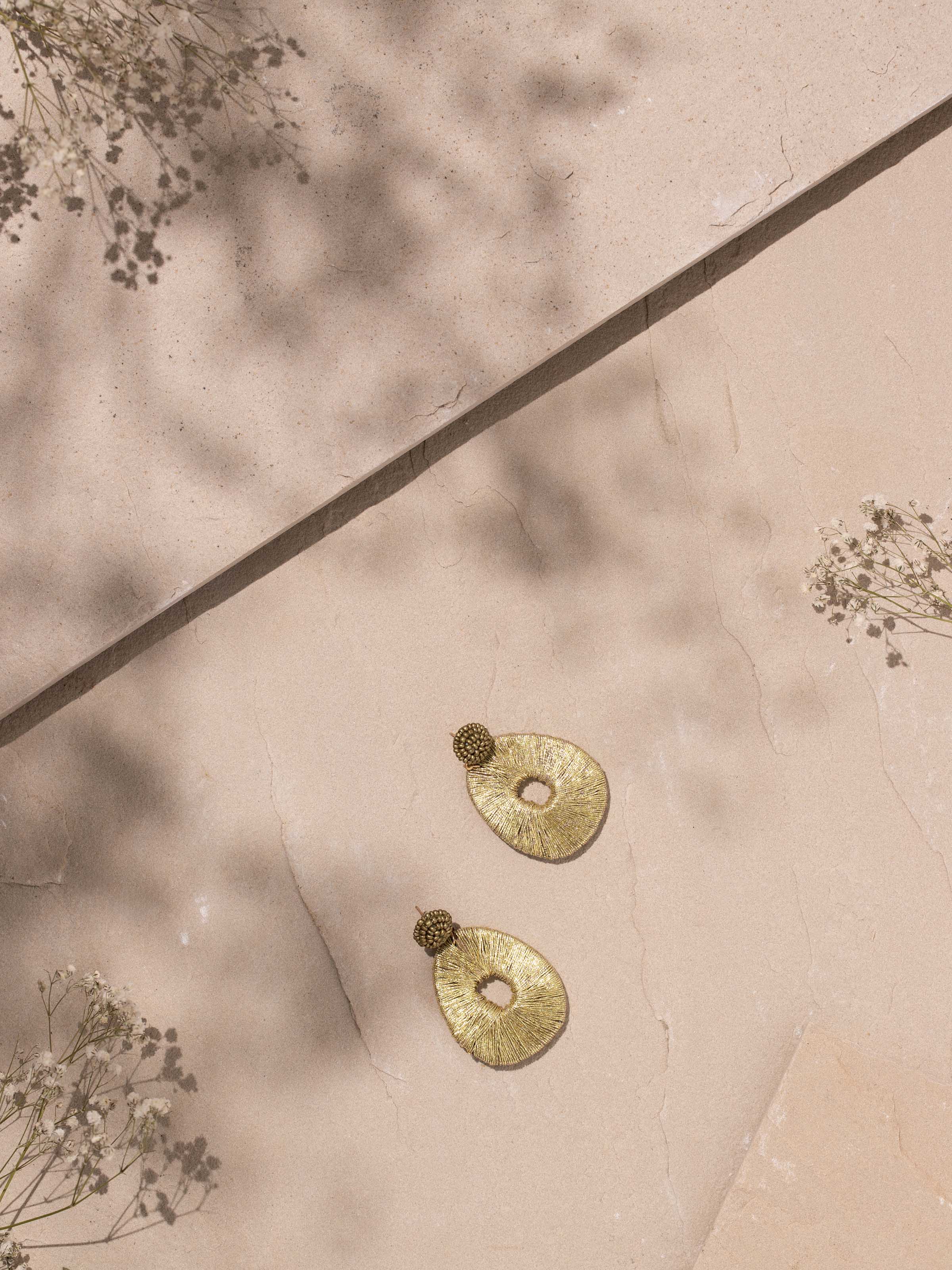 Side view of Handcrafted Drop Earrings showcasing their elegant design.