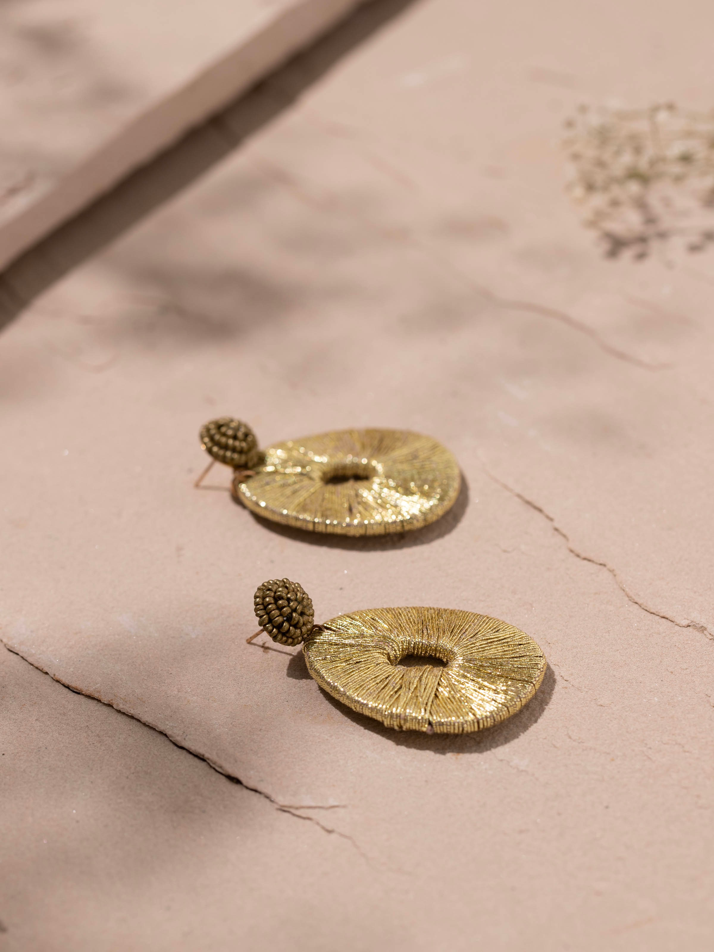 Back view of Handcrafted Drop Earrings showcasing hook and design details.