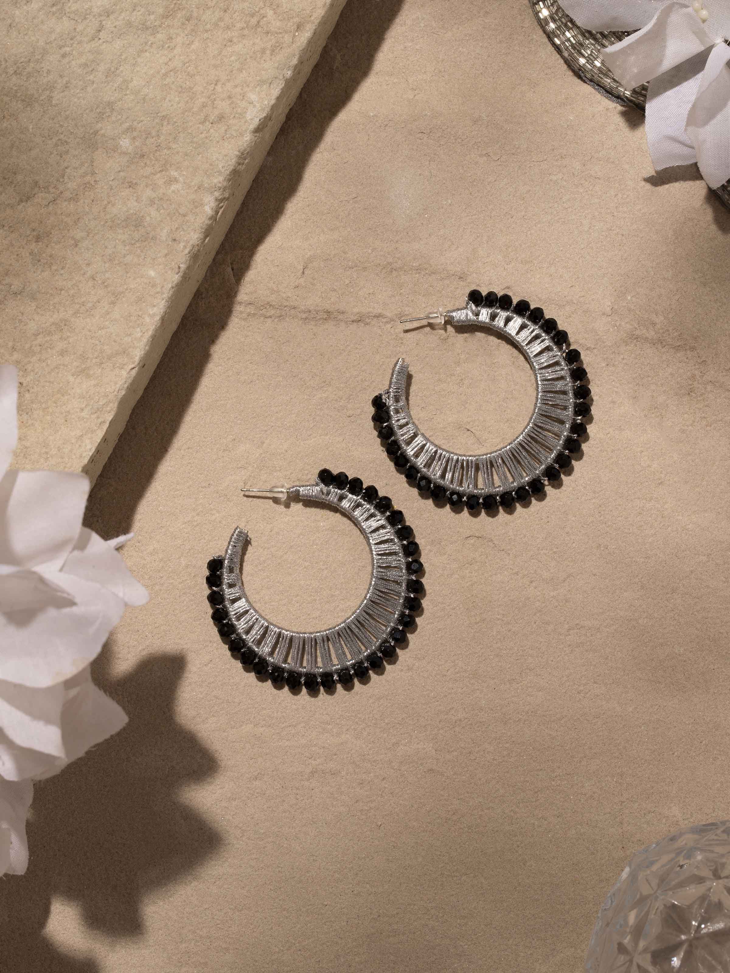 Close-up of Handcrafted Hoop Earrings highlighting detailed work and elegant finish.