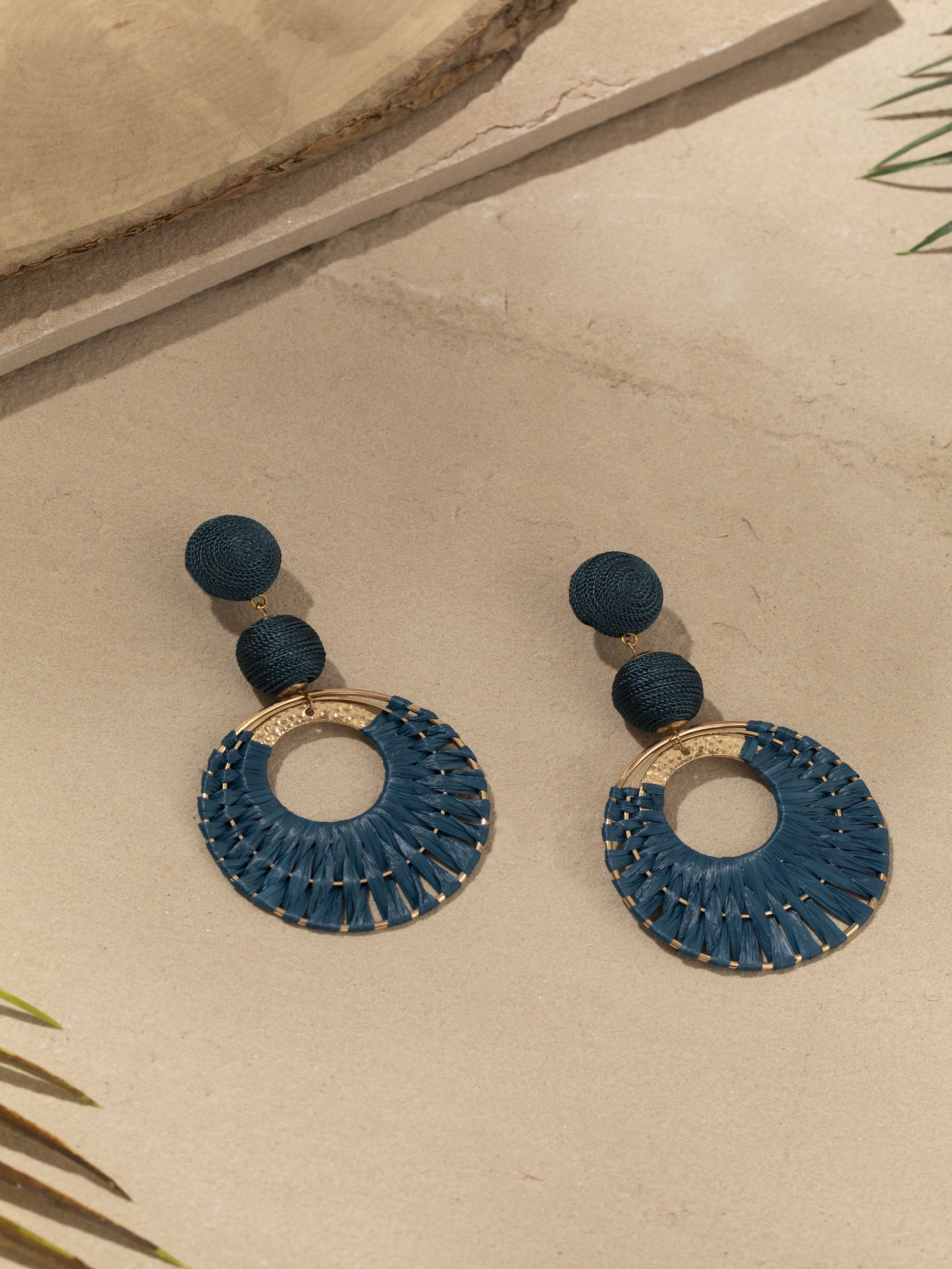 Side view of Handcrafted Drop Earrings emphasizing the elegant drop shape and intricate detailing.