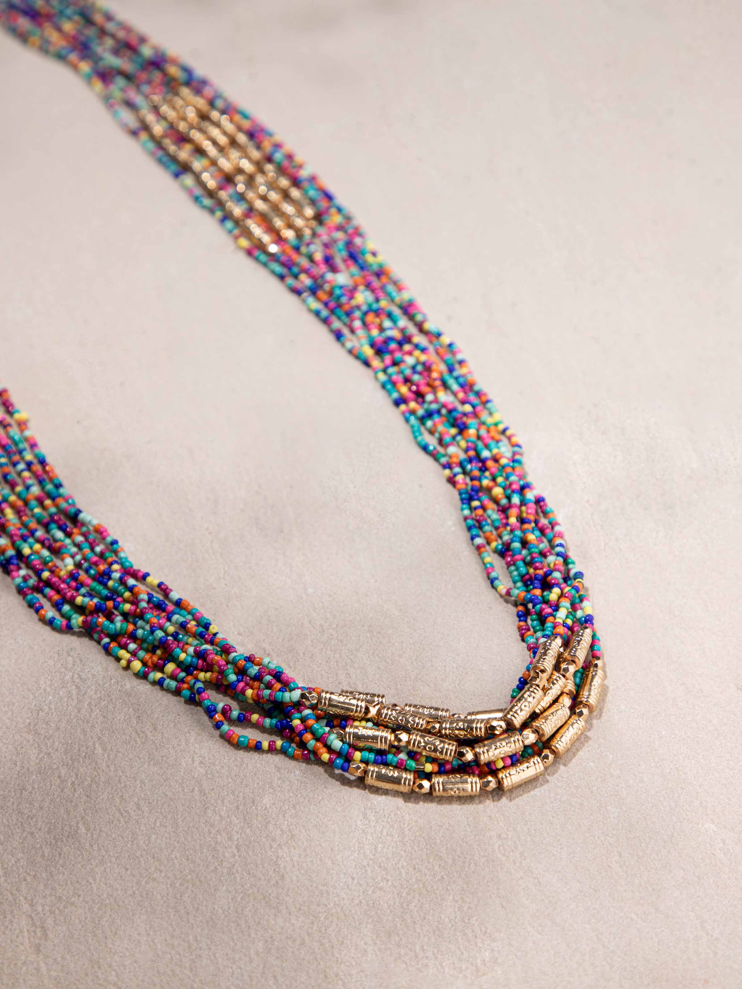 Angled shot of handcrafted collar necklace emphasizing its unique style